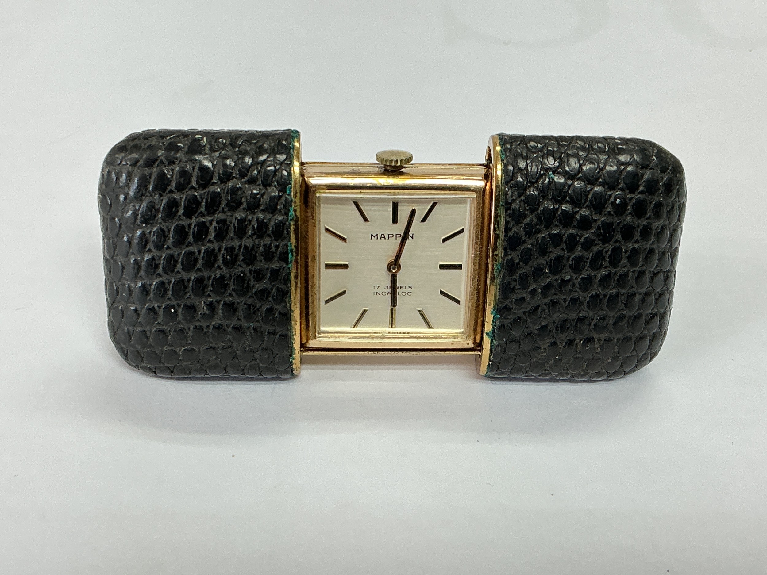 A vintage Mappin slide action travel watch, gold plated with leather case.