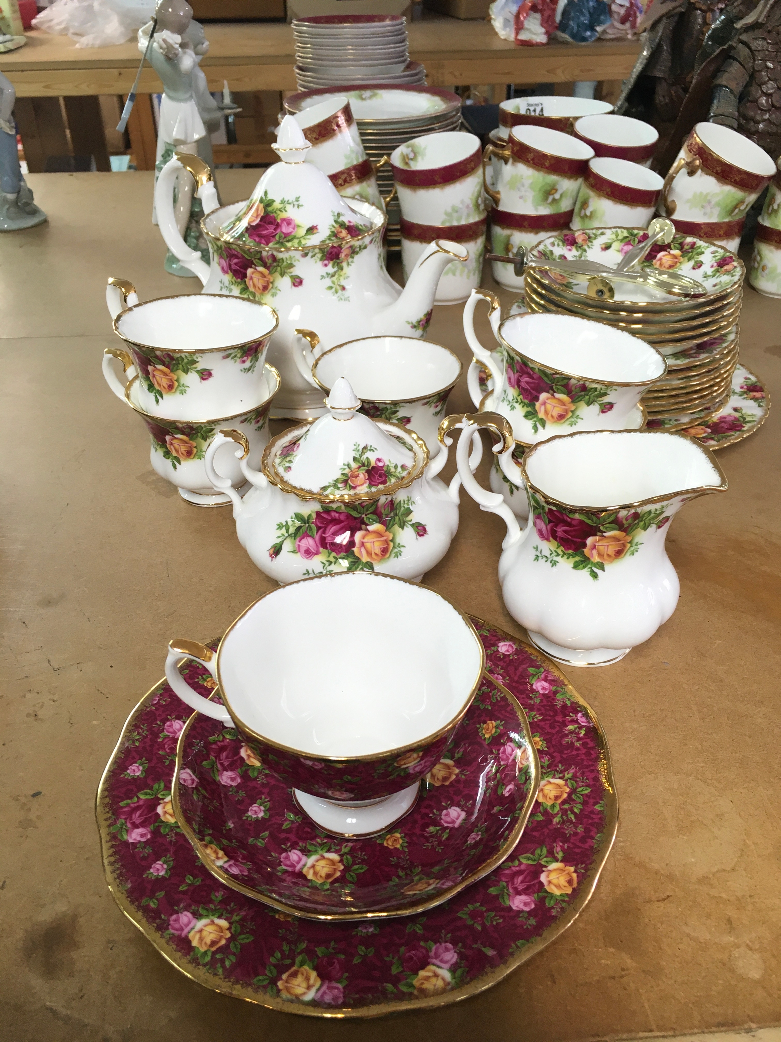 An Old English Country rose tea set and a ruby lace trio