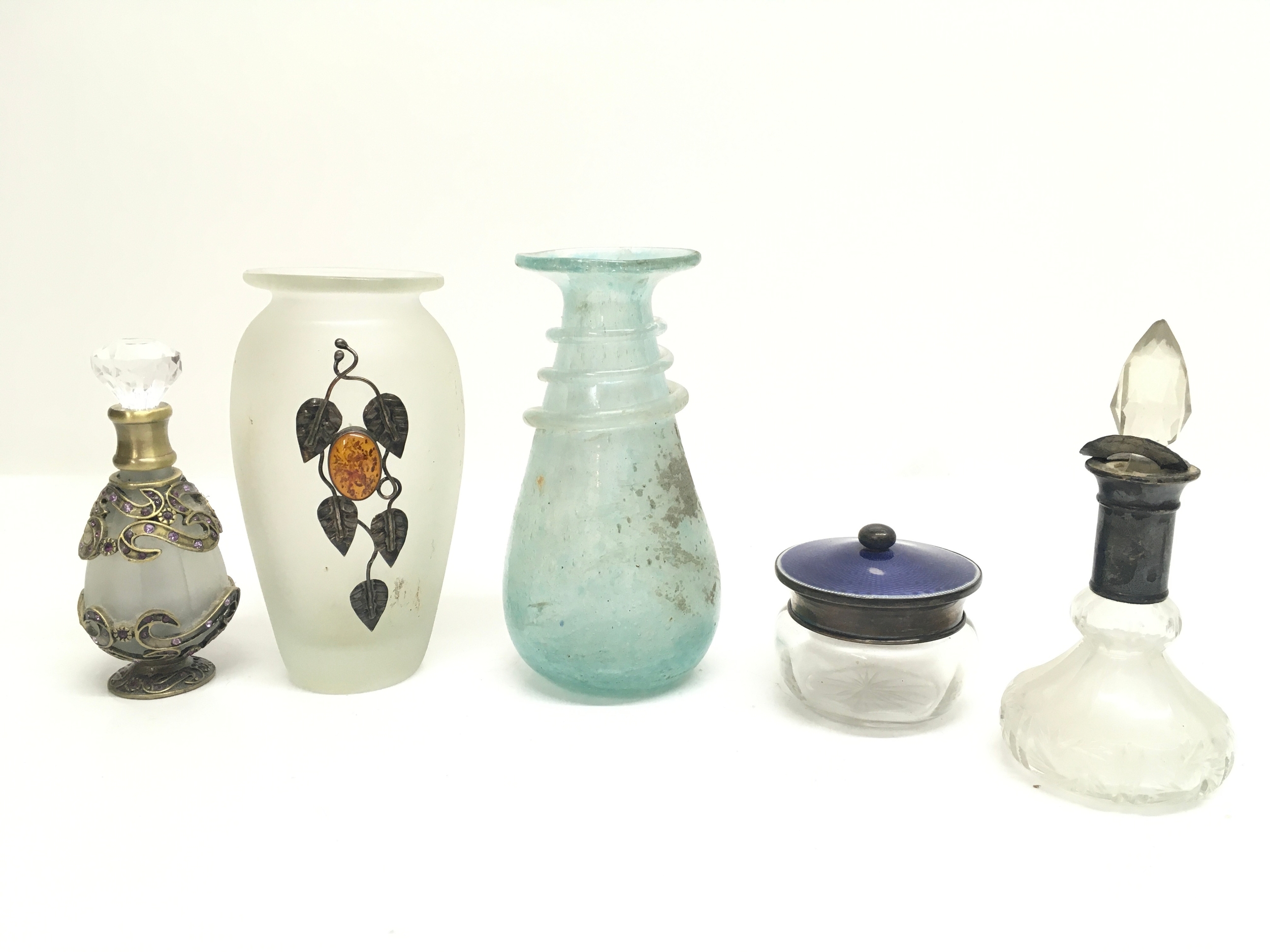 Guilloche enamelled topped silver hair tidy and four vases to include Roman style