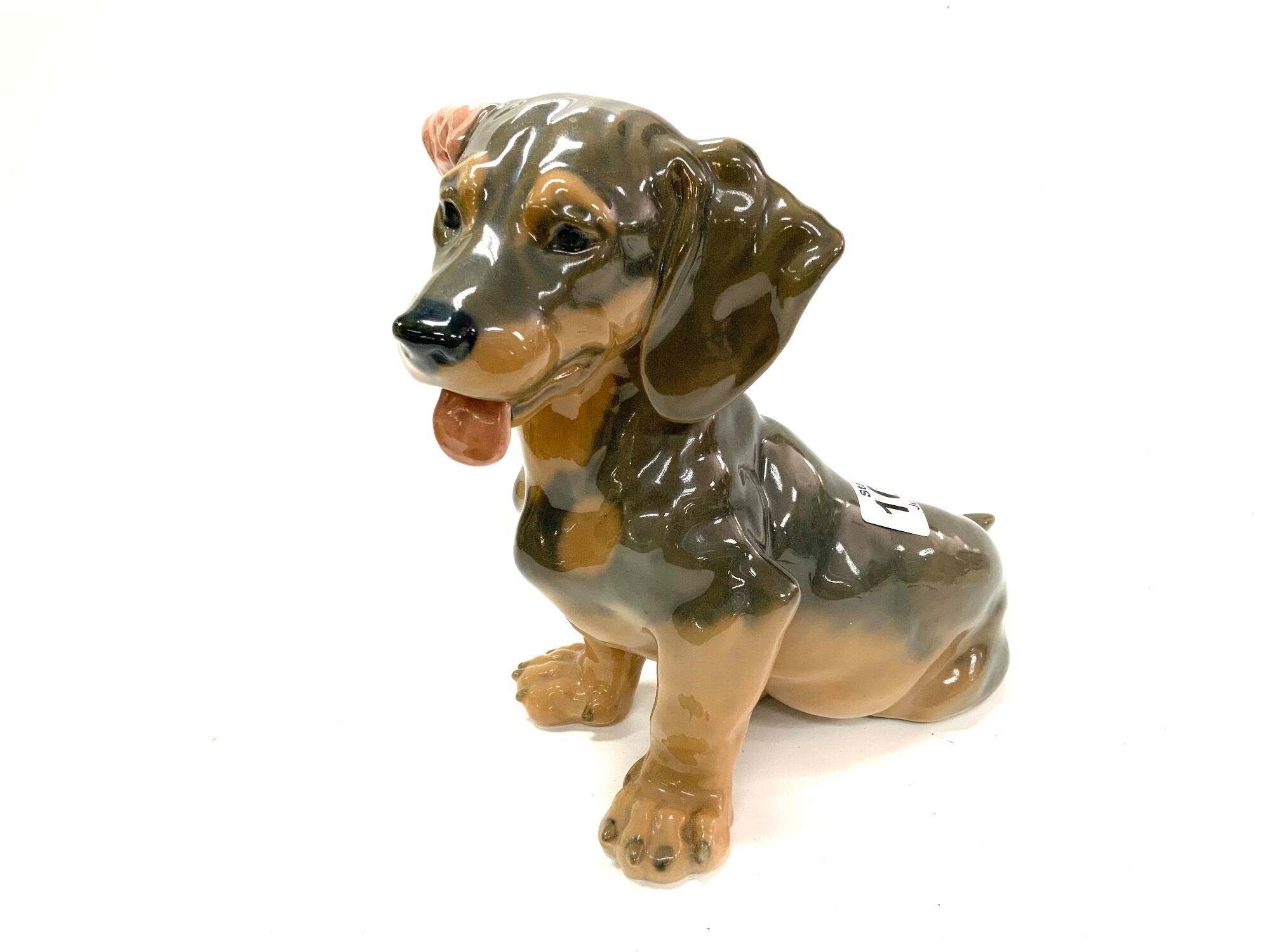 A Royal Copenhagen ceramic model dachshund puppy. H.19cm NO RESERVE