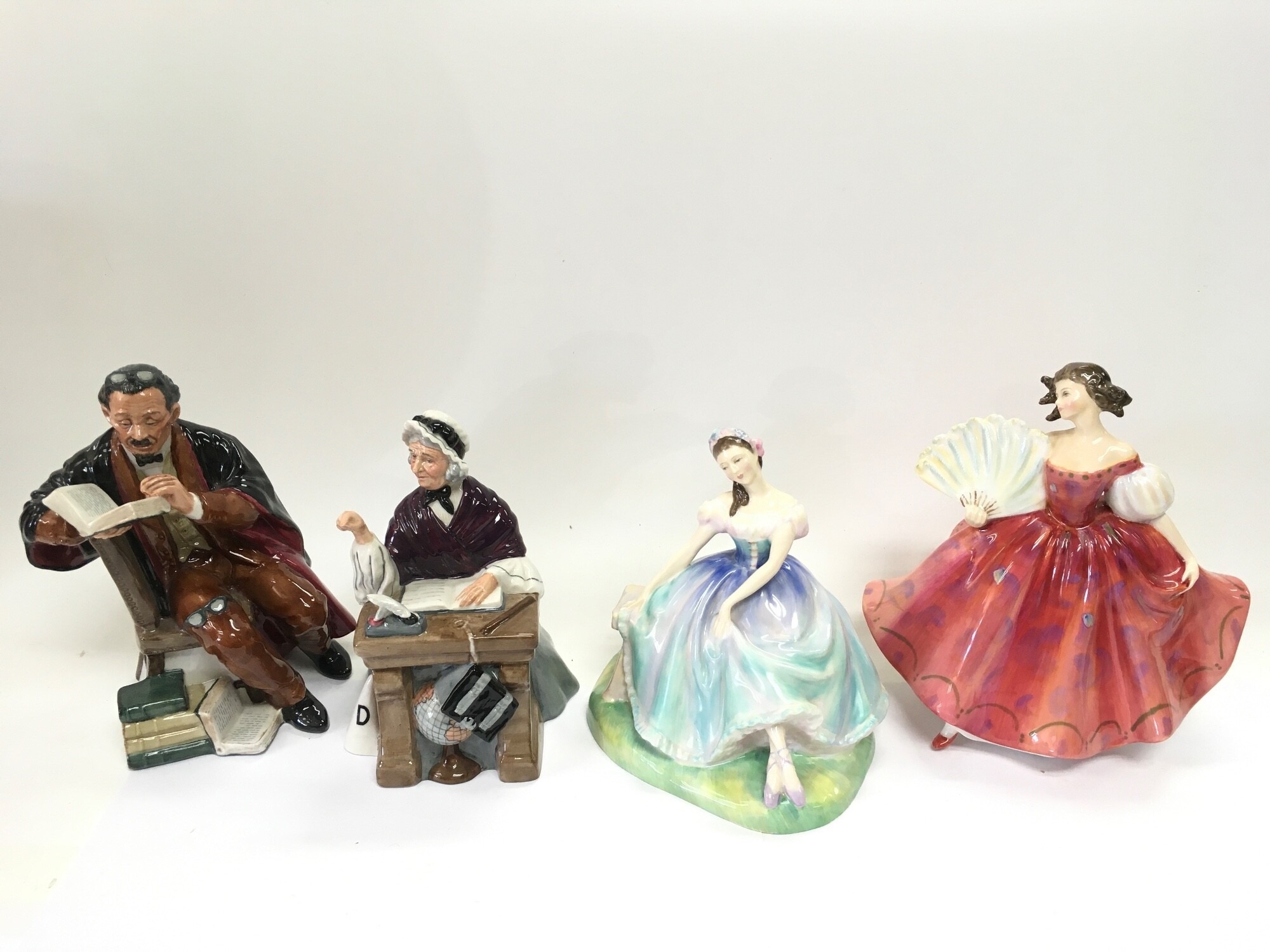 Four Royal Doulton figures comprising Schoolmarm HN2223, The Professor HN2281, Giselle HN2139 and First Waltz HN2862. NO RESERVE