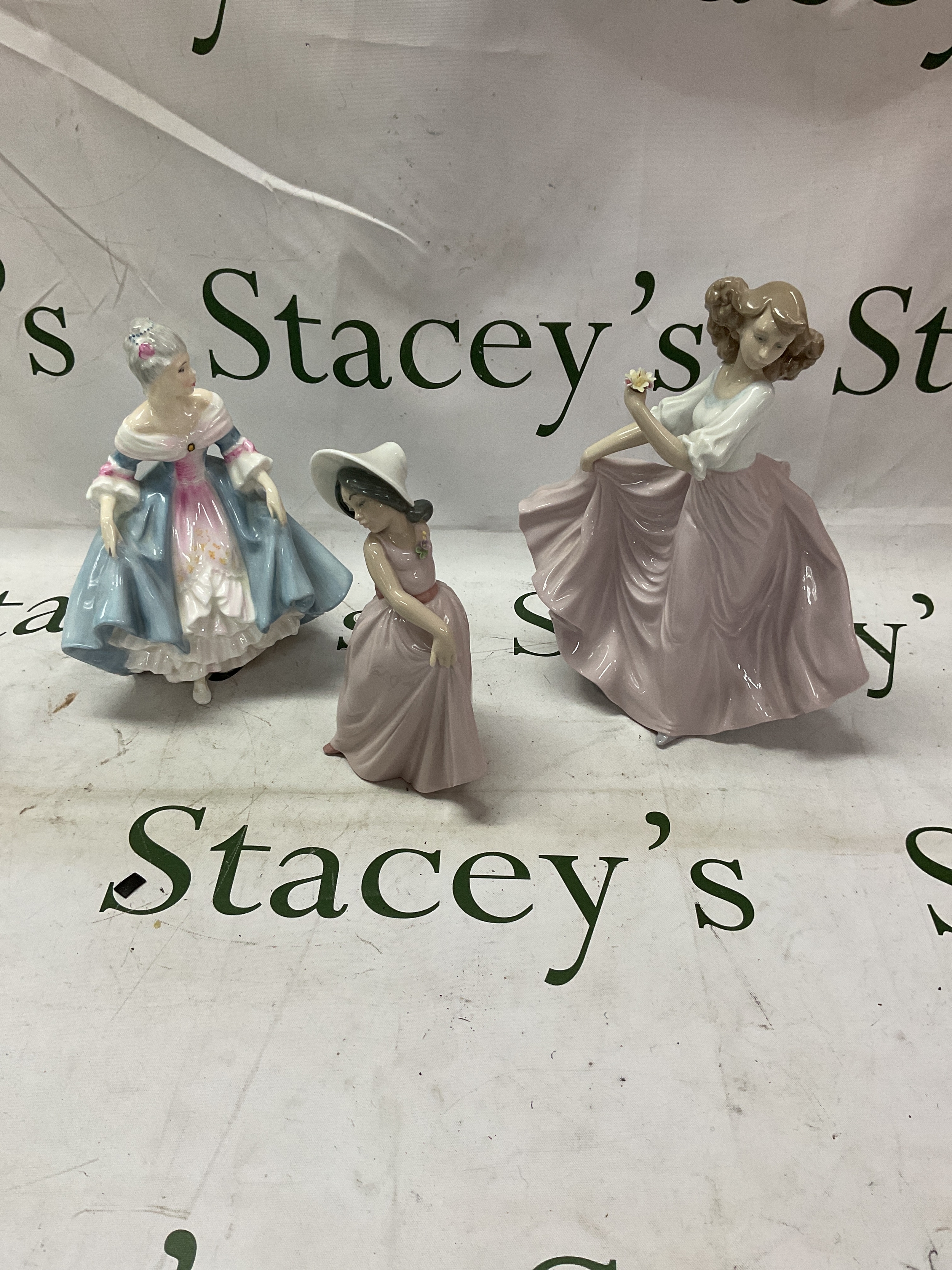 Two Lladro figurines and Royal Doulton HN2425 southern belle figurine.