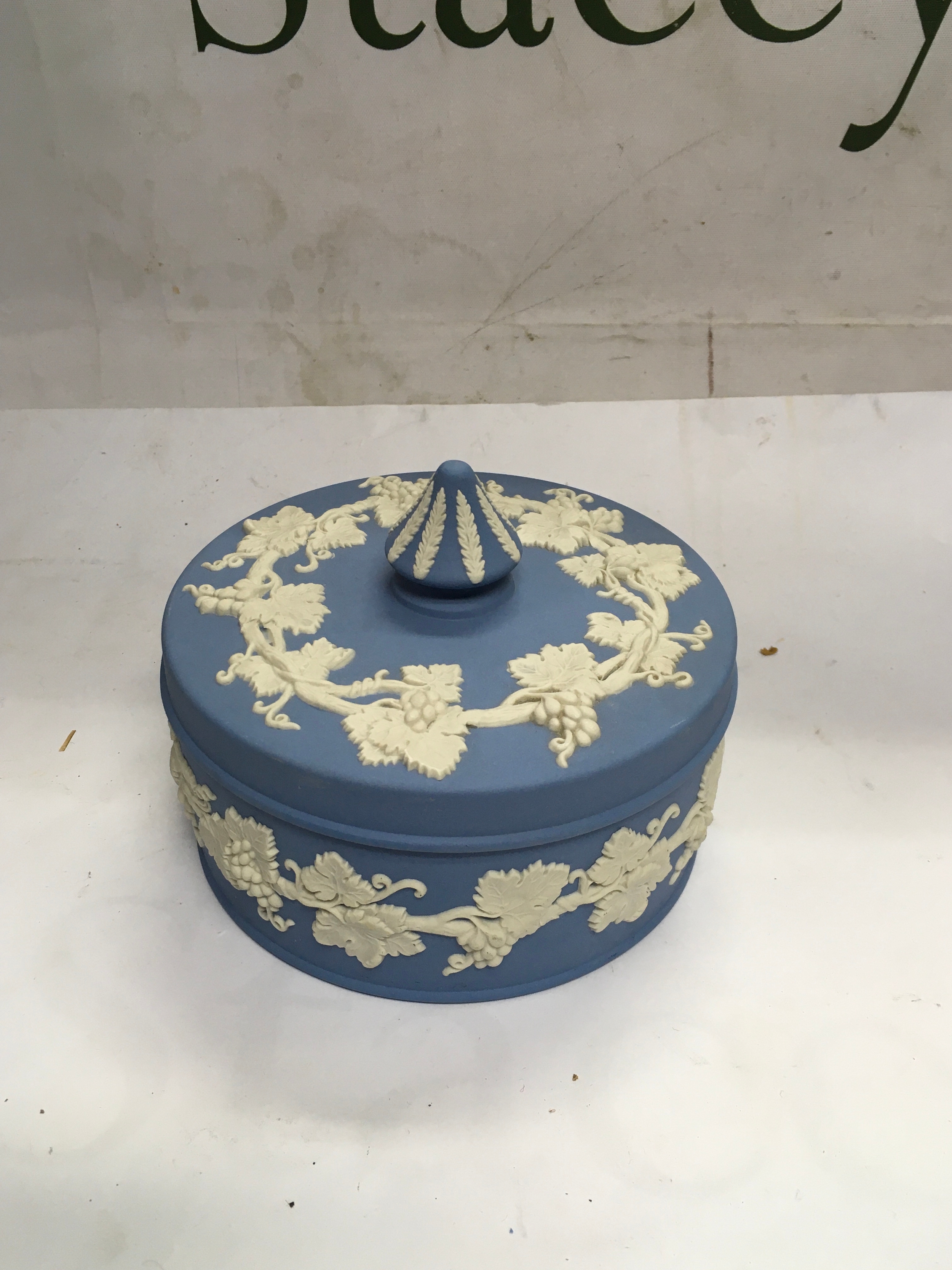 A Wedgwood Blue Jasperware round covered trinket box.