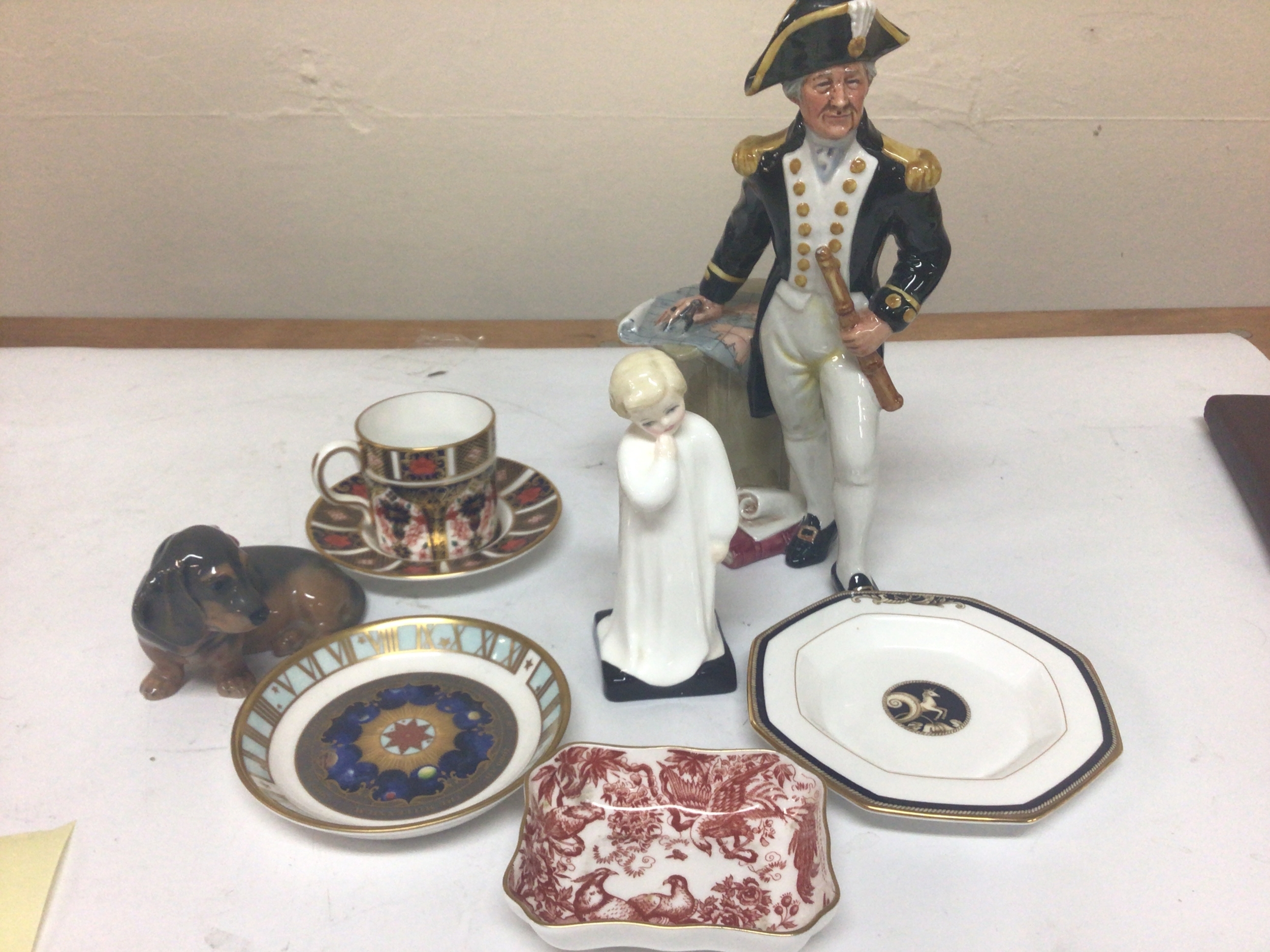 A collection of Royal Doulton Royal Crown Derby and other ceramics including a Royal Copenhagen dog figure. Doulton figure the Captain no obvious damage (7) 