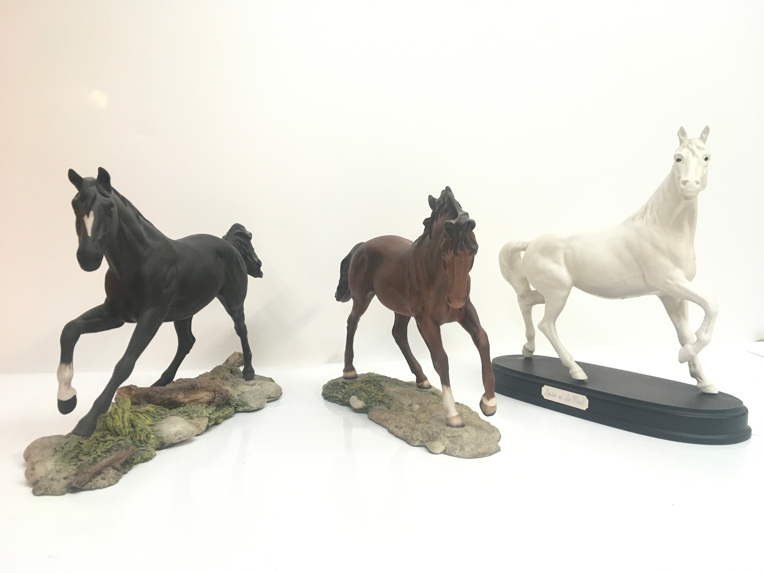 Three Royal Doulton horses one A/F. 20 and 25cm tall