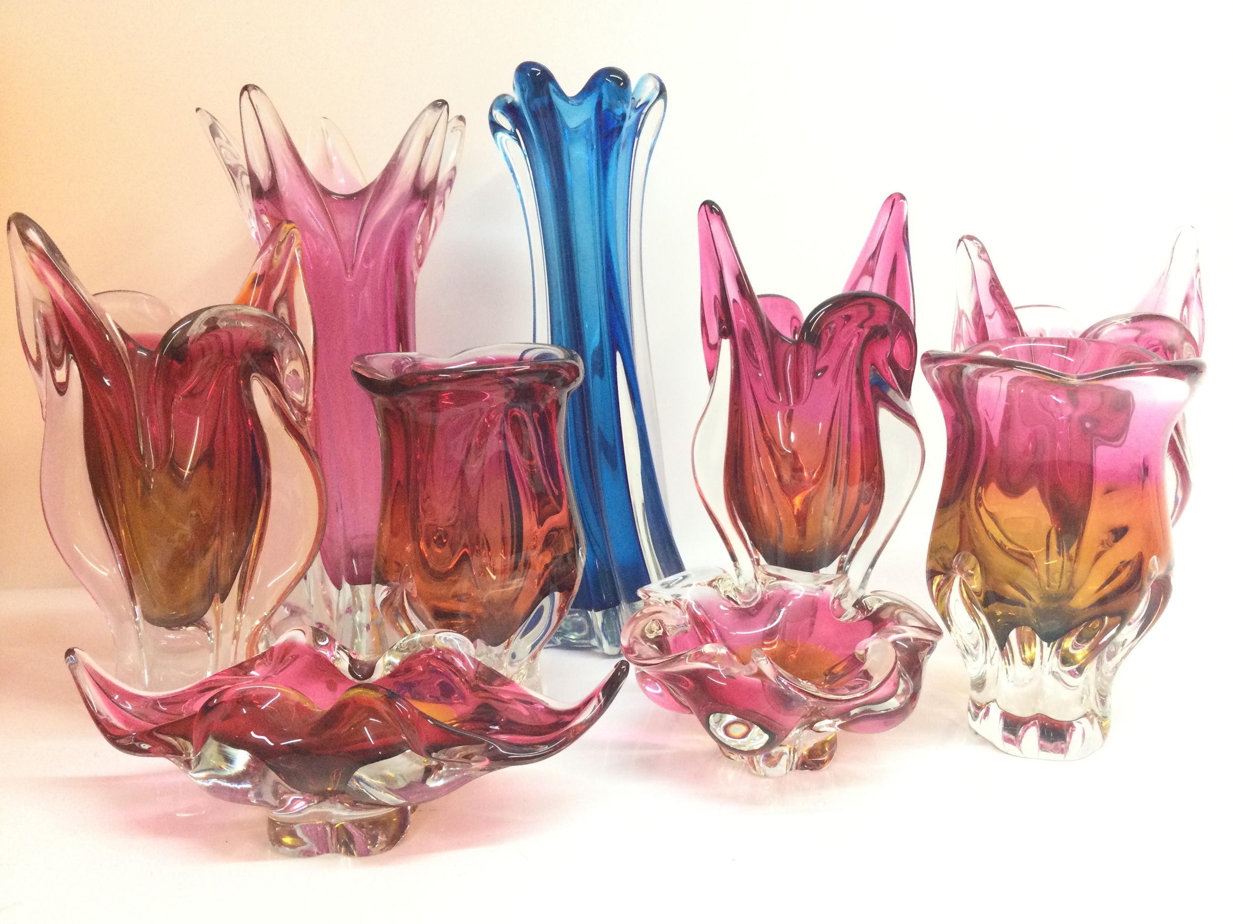 A large collection of art glass vases Including a Mdina random strapping vase, two glass decanters etc