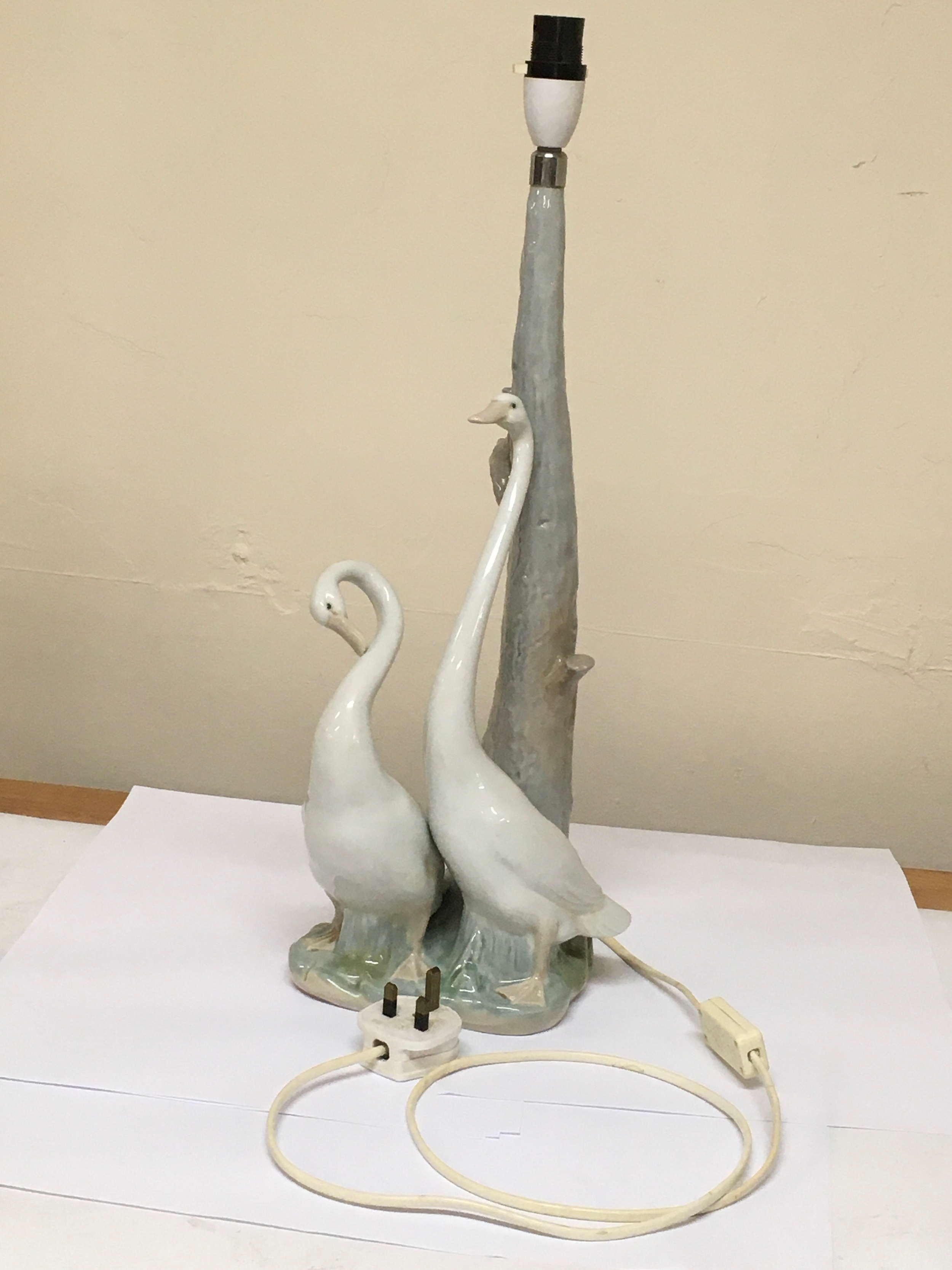 An assortment of 15 Spanish Lladro and English Coalport figurines. 1 Geese figurine doubles as a lamp.