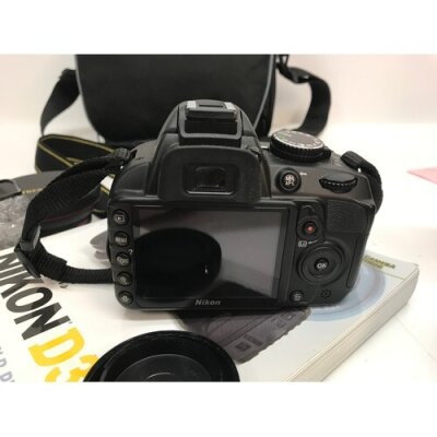 A Nikon D3100 camera (seen working) with accessories including lens Nikon 200mm, Nikon 70mm, Nikon 55mm, Nikon 300mm and others