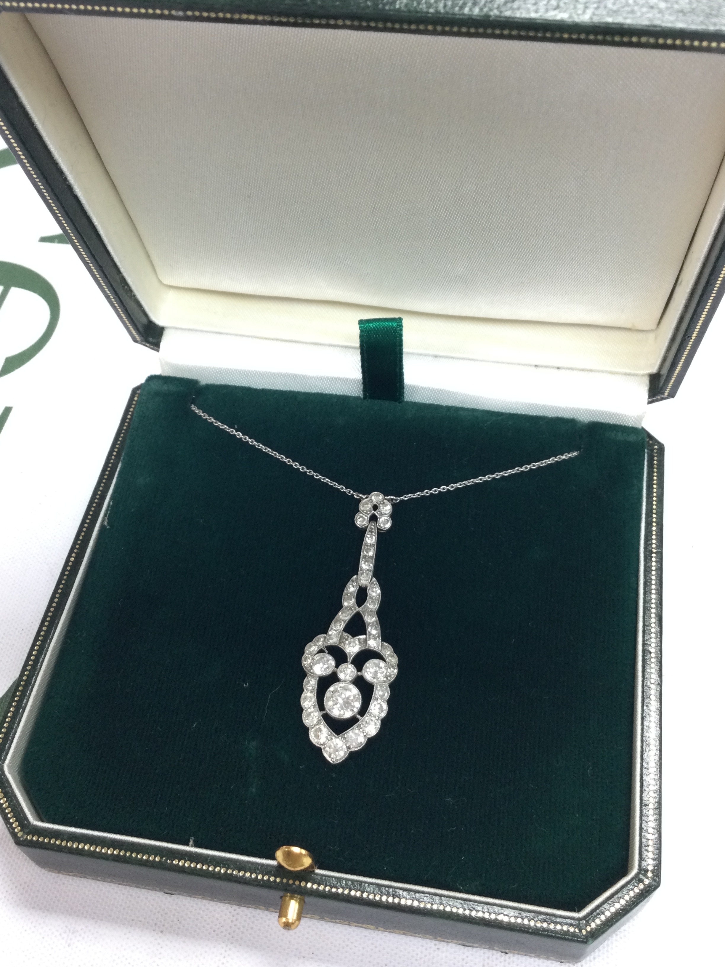 A diamond set platinum pendant. Chain 22cm long, pendant 4.3cm long approximately 
