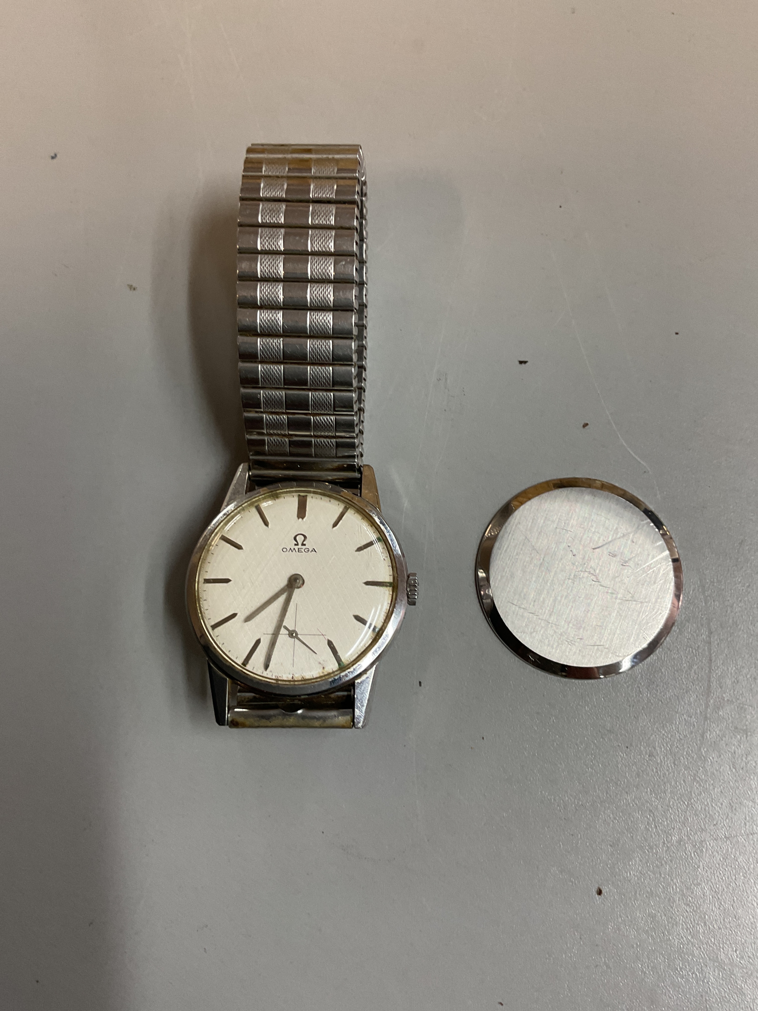 Omega gentlemans wristwatch with baton indicators and subsidiary dial, 17 jewel 269 movement Ser no 2159868, on stretch strap,32 mm steel case.