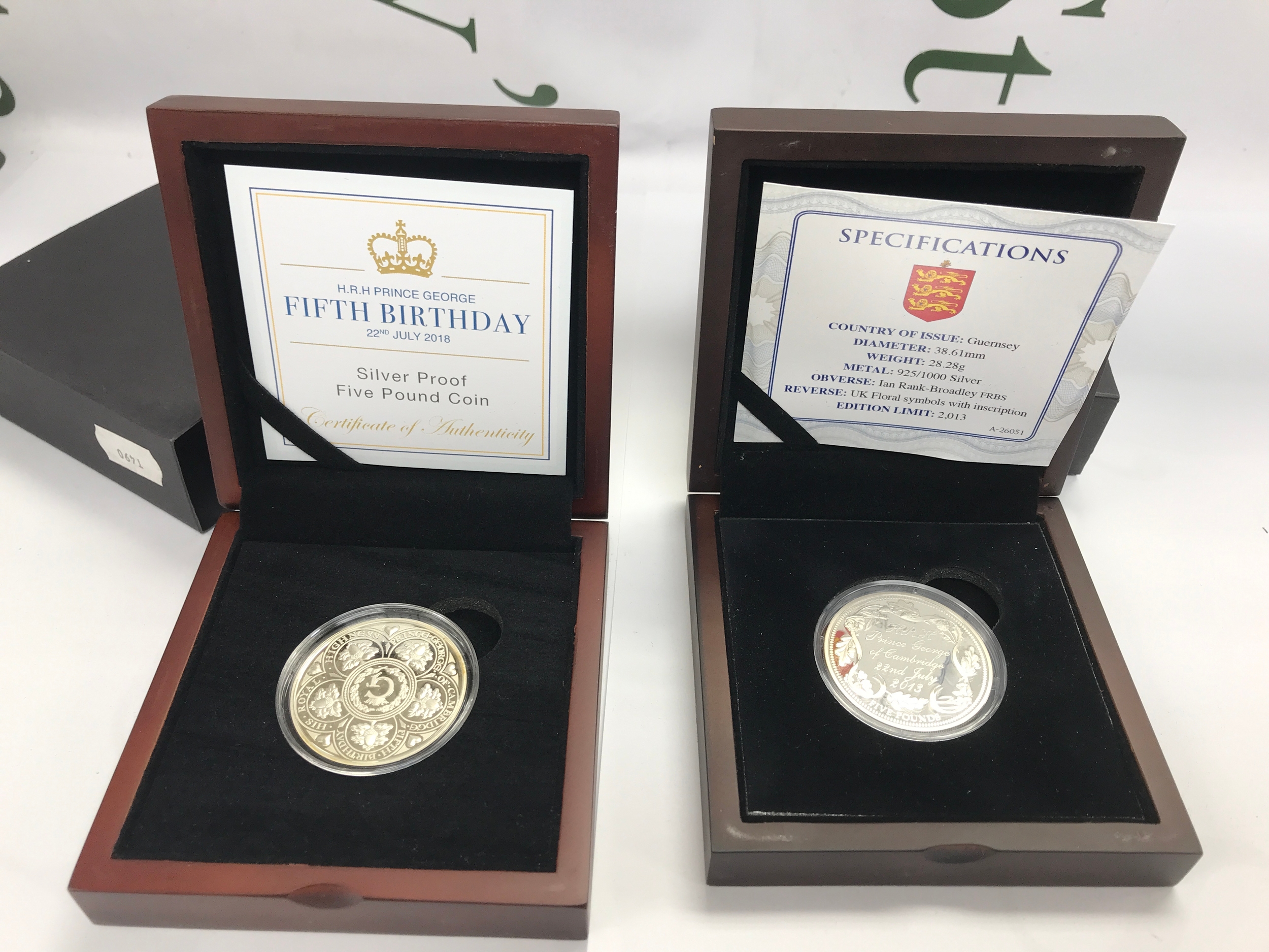 2013 Guernsey Silver Proof £5 Coin celebrating the birth of H.R.H. Prince George of Cambridge and a silver proof £5 coin celebrating his 5th birthday.