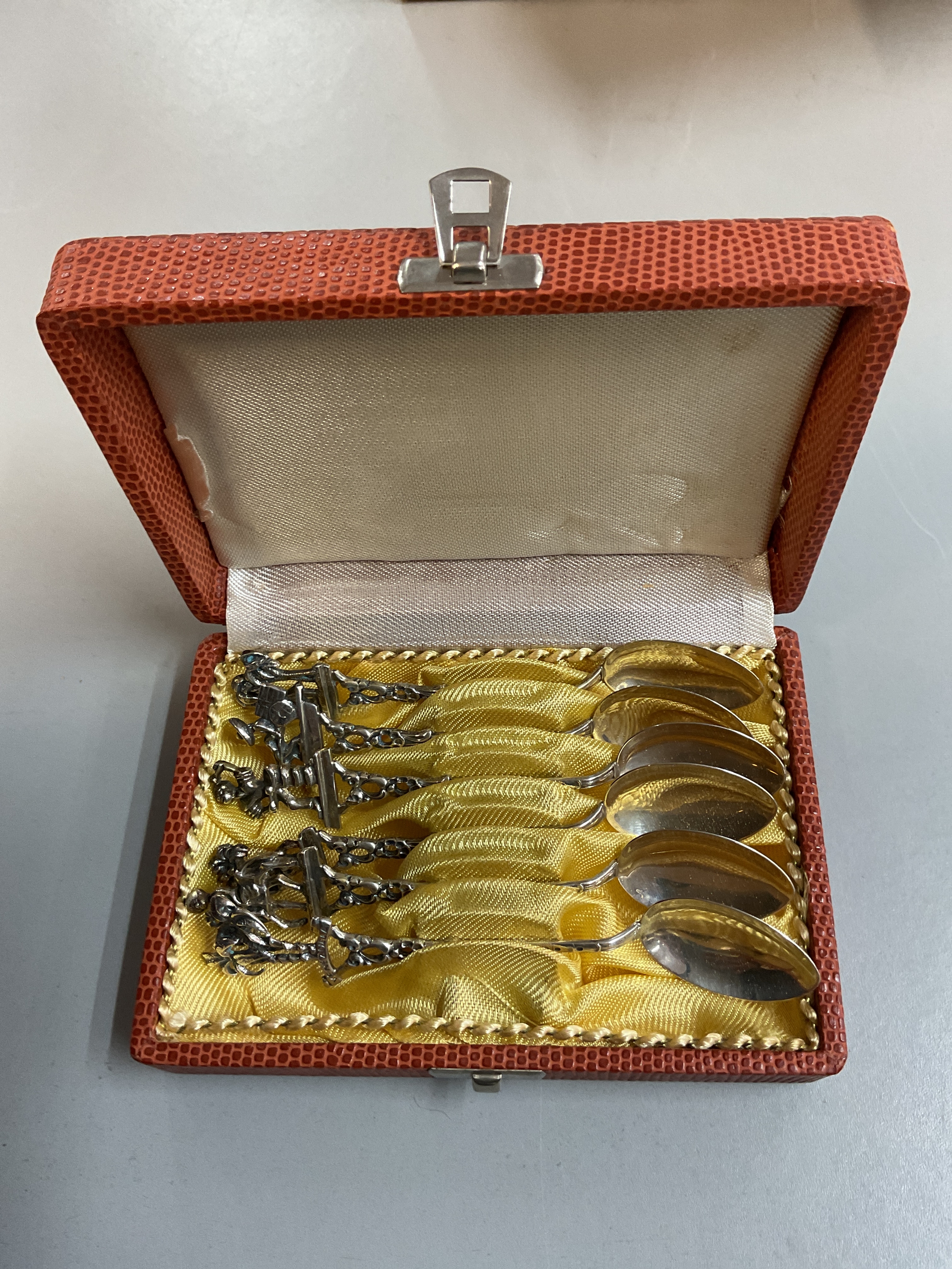 Cased set of six 0.835 silver ornate tea spoons.