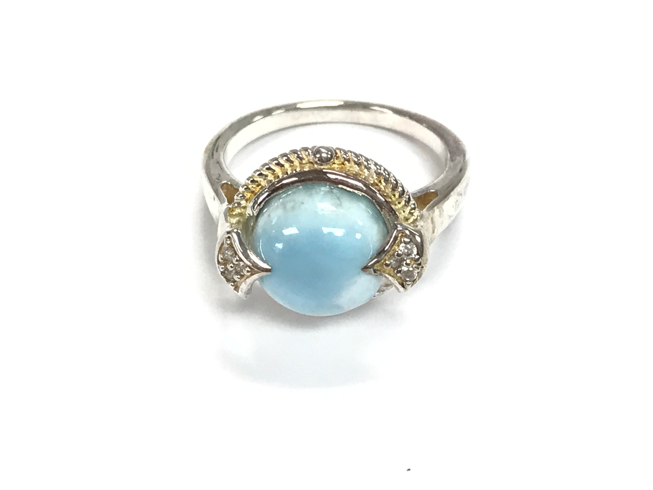 A silver ring set with a round Larimar. Size N 1/2