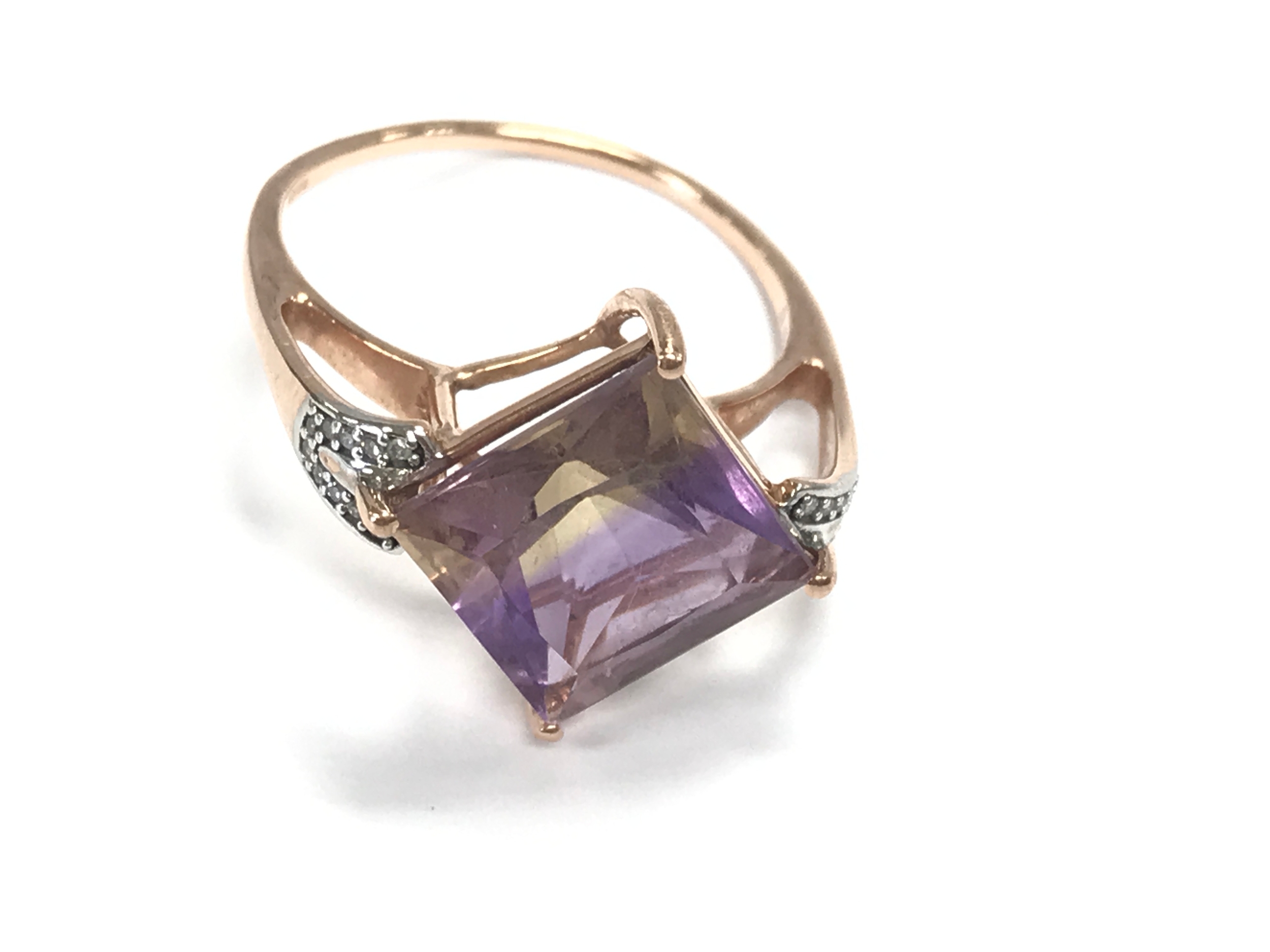 A 9ct rose gold Ametrine and diamond ring. Size S and 3.5g