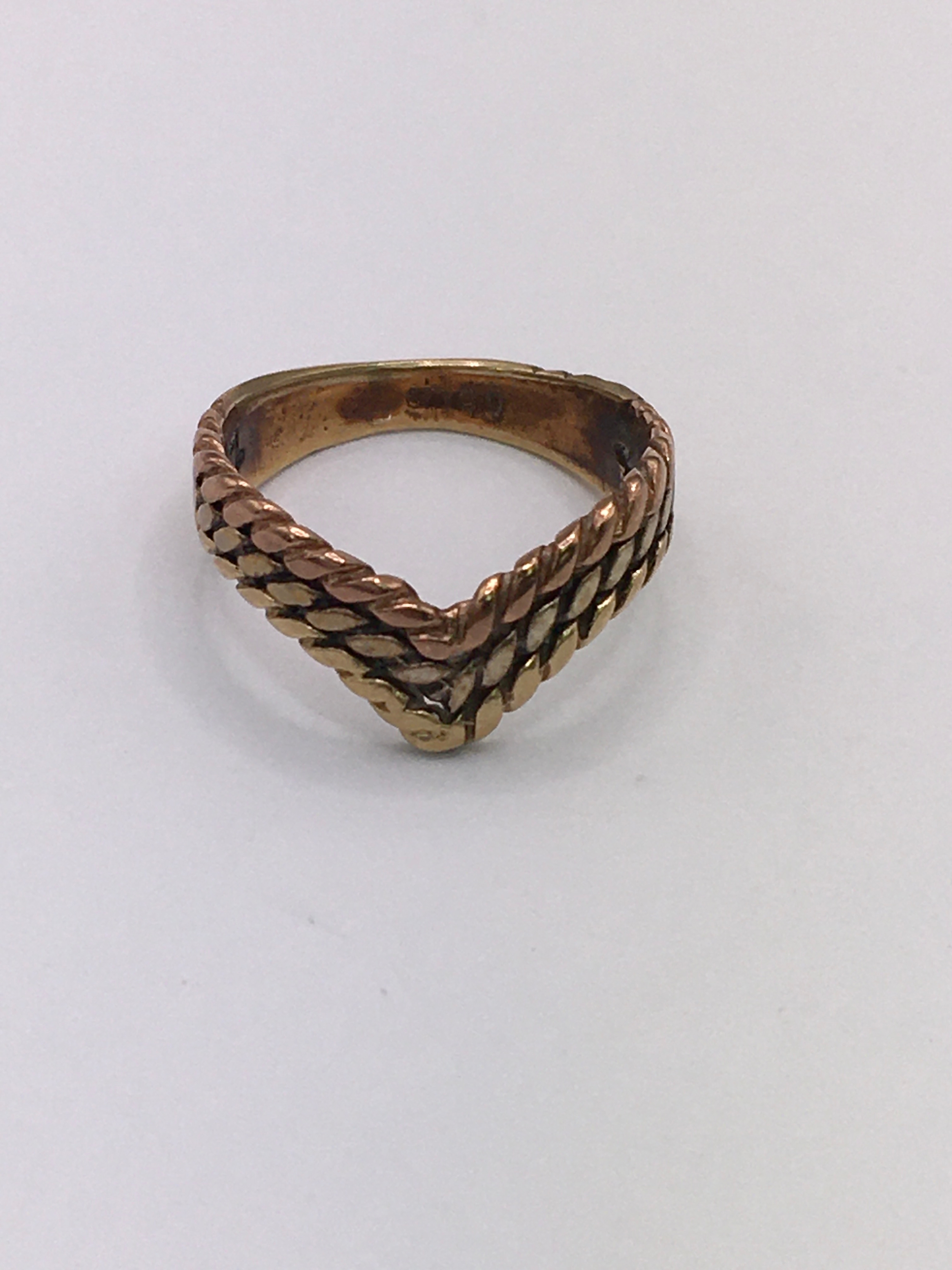 A 9ct gold, multi tone V shaped ring of woven design.Approx G, small size.