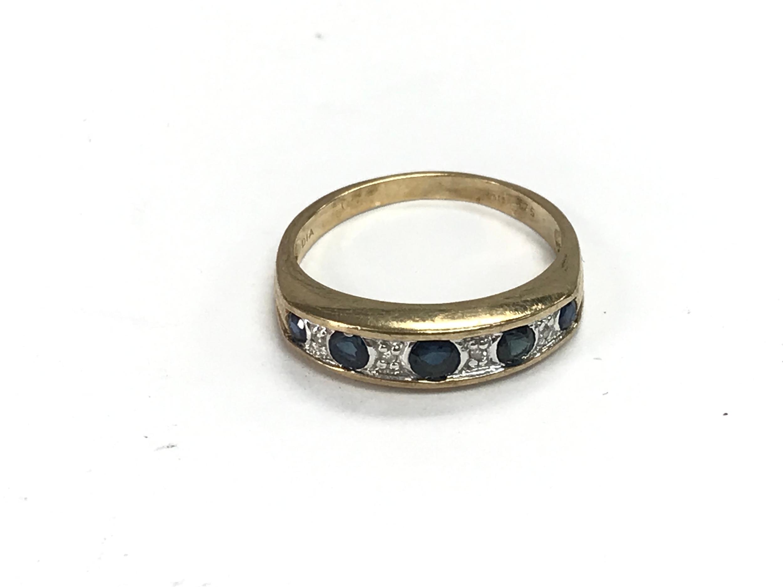 A 9ct gold diamond and sapphire ring. Size L and 2g
