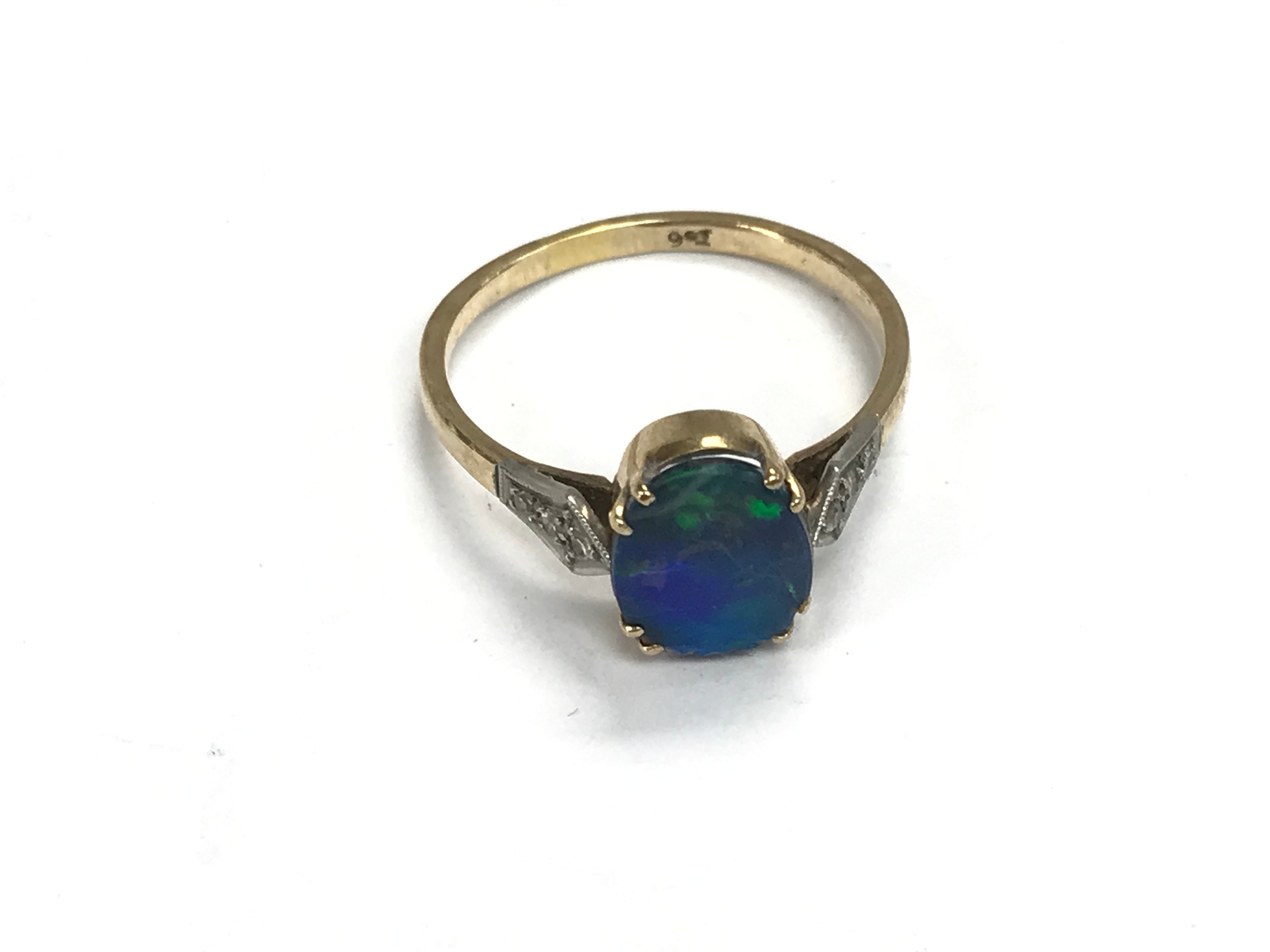 A 9ct gold ring set with Opal doublet. Size R and 2.3g