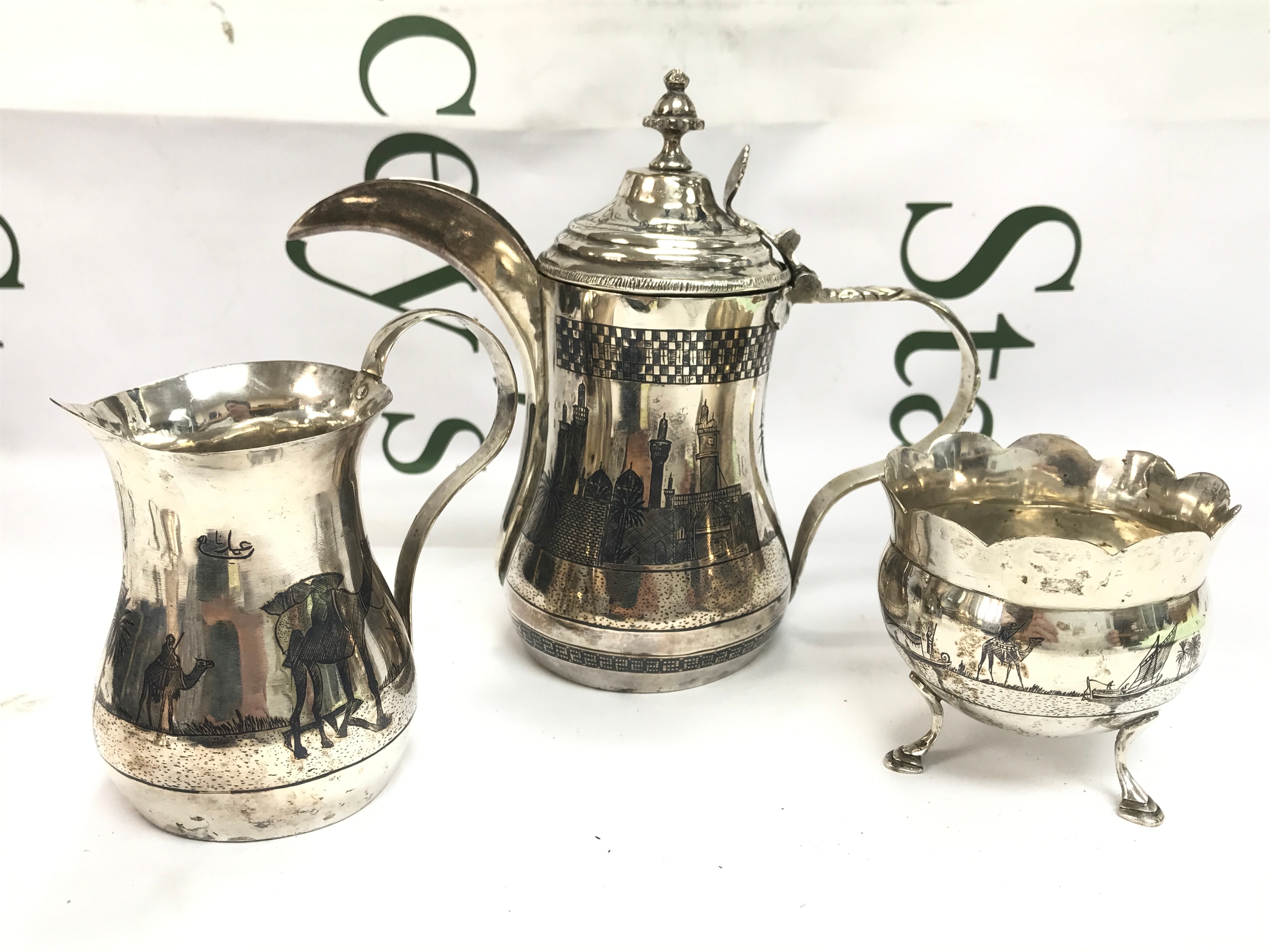 An eastern three piece silver coffee set 6.5 to 16cm tall. 550g total weight 