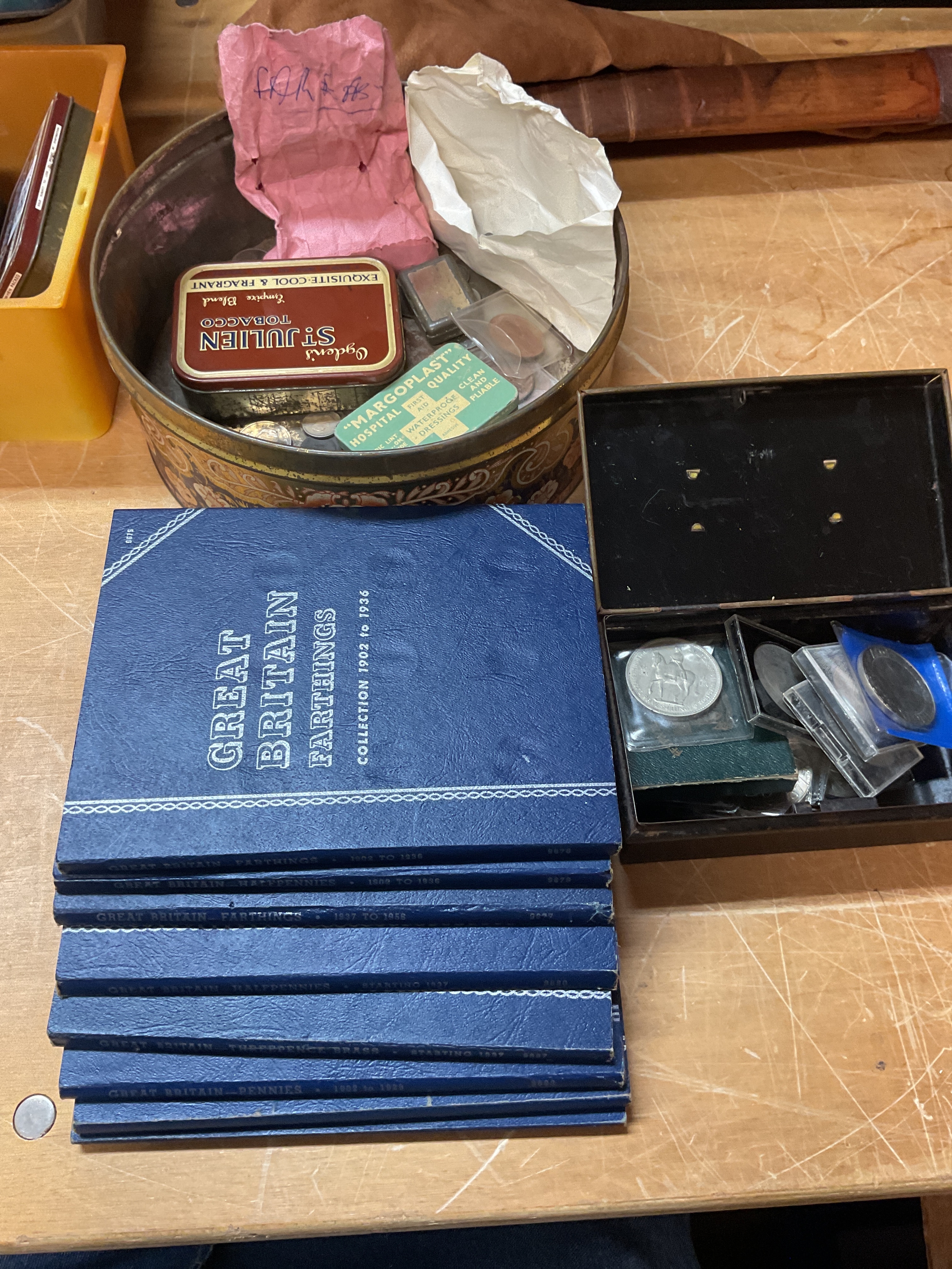 Eight Whitman folders and loose coins, crowns etc in tins.