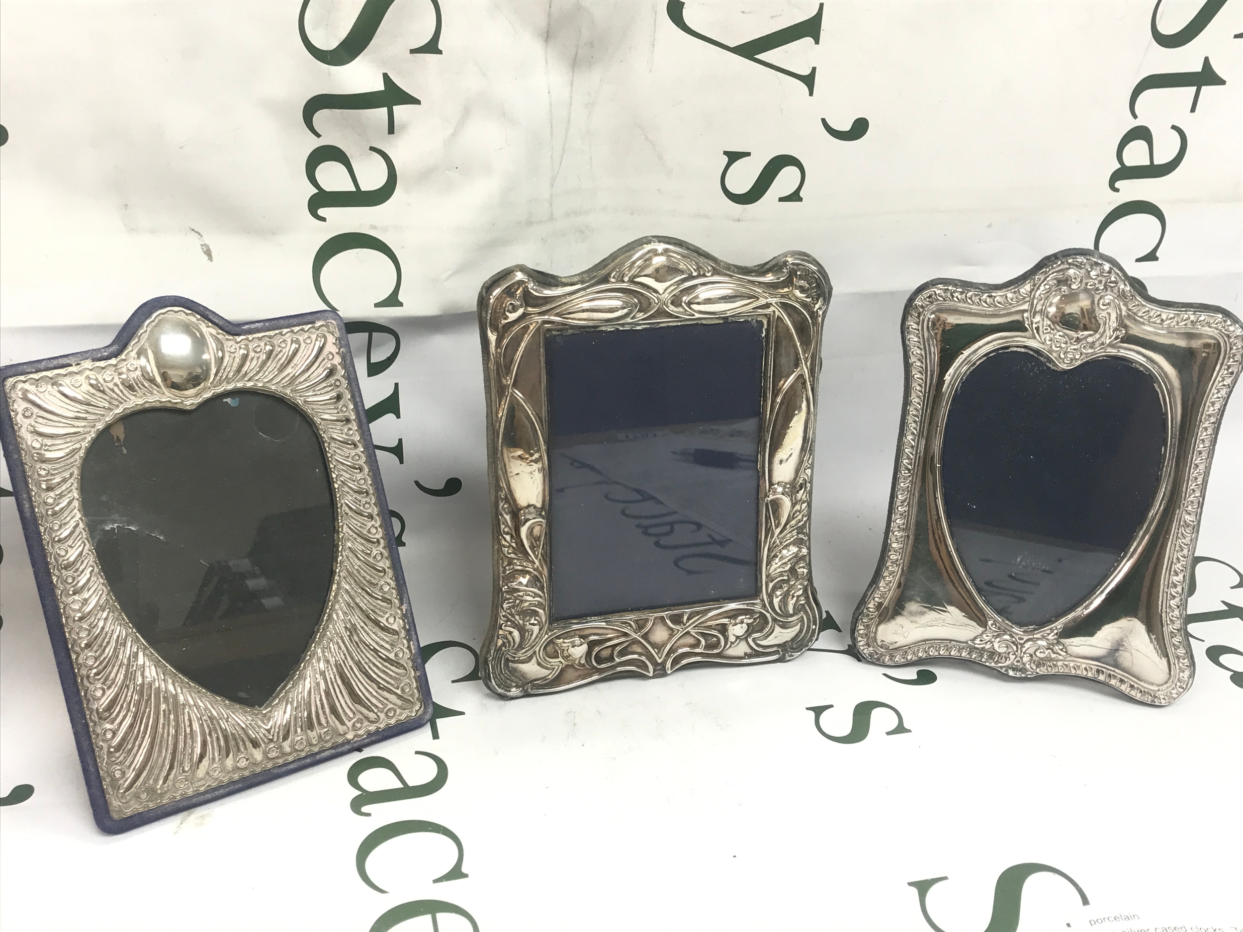 Three silver photo frames. 14/15x20cm
