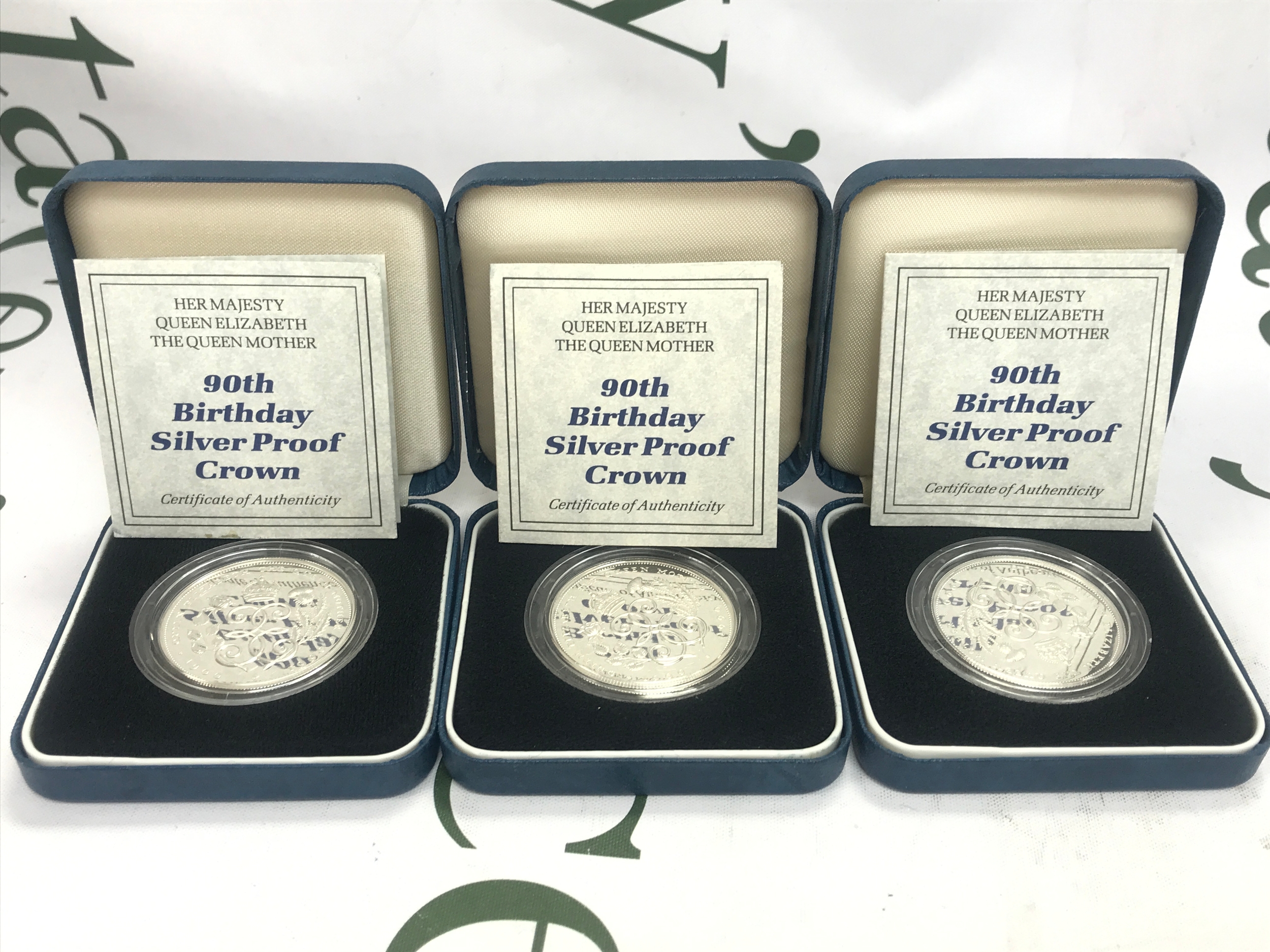 Three silver proof crowns 