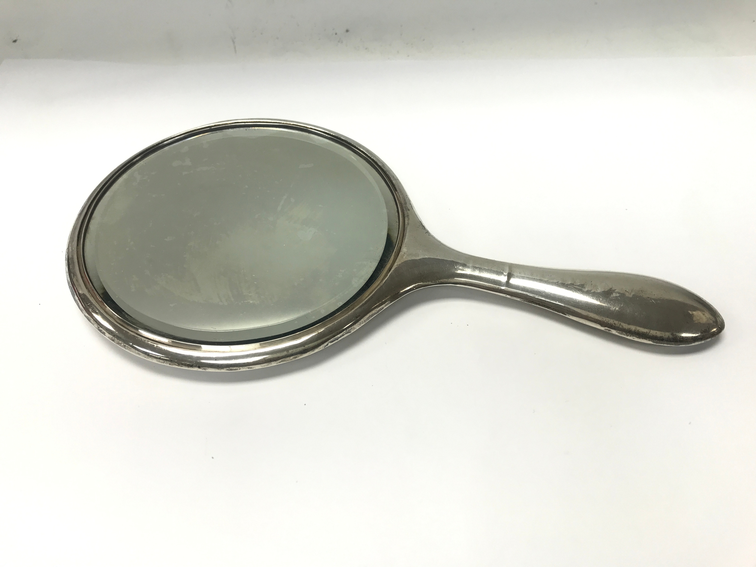 A hallmarked silver hand mirror.