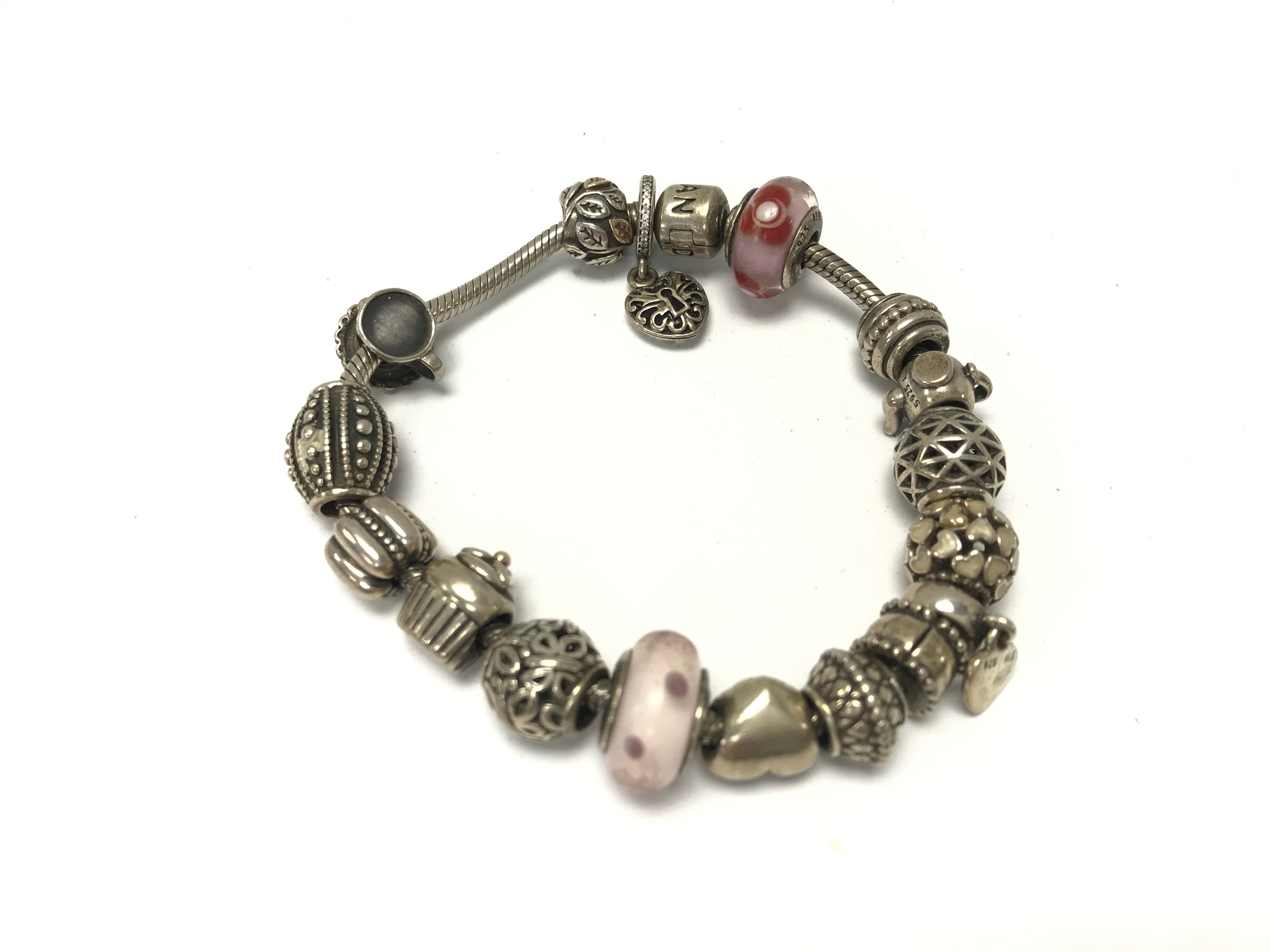 A Pandora bracelet with a number of charms.