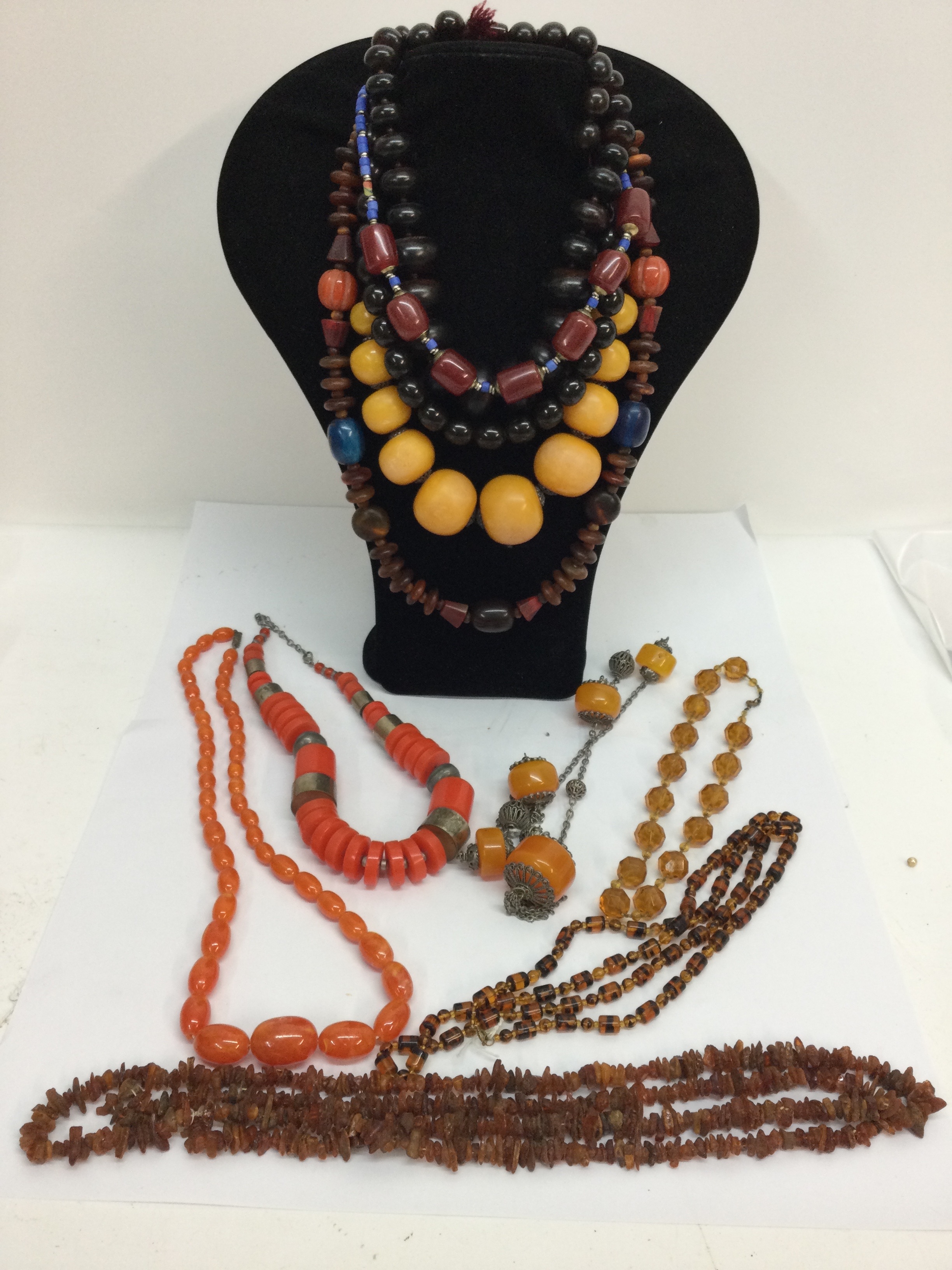 A reconstituted amber necklace, plus various vintage ethnic bead necklaces
