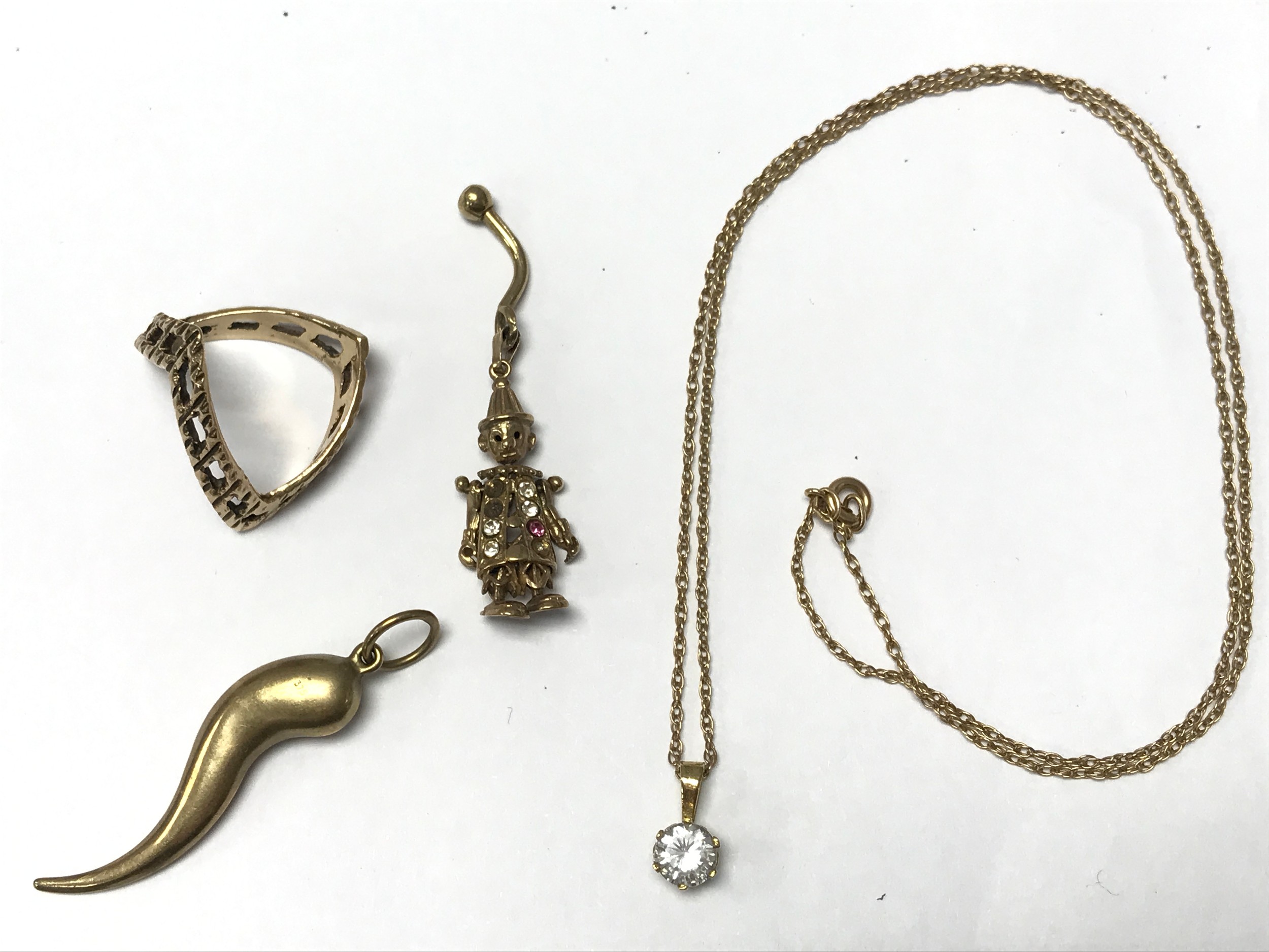 Small collection of 9ct gold including pendants and a ring 9.36g. Chain 22cm long
