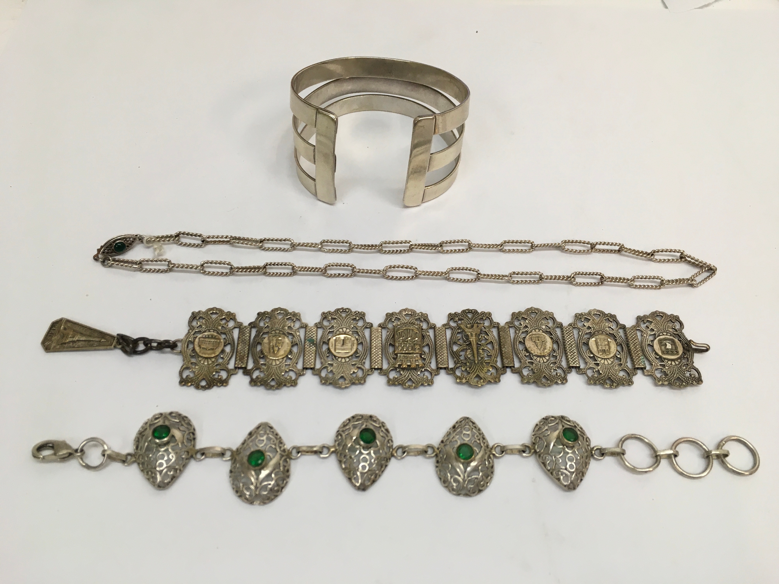 A 925 silver modernist cuff bangle, vintage tourist bracelet, and one other bracelet and chain.