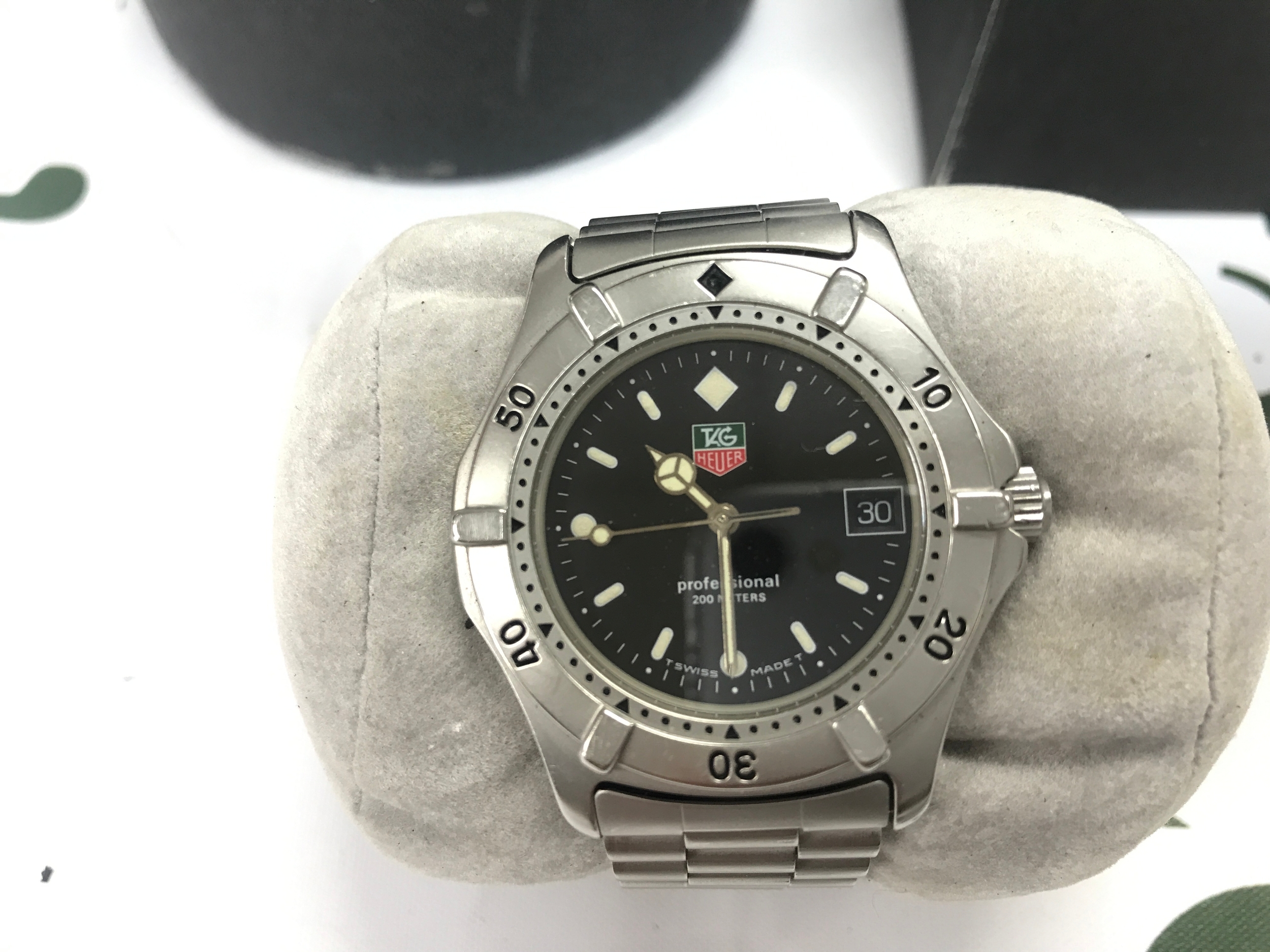 vintage TAG Heuer Professional 2000 Series quartz watch with a black dial and stainless steel case