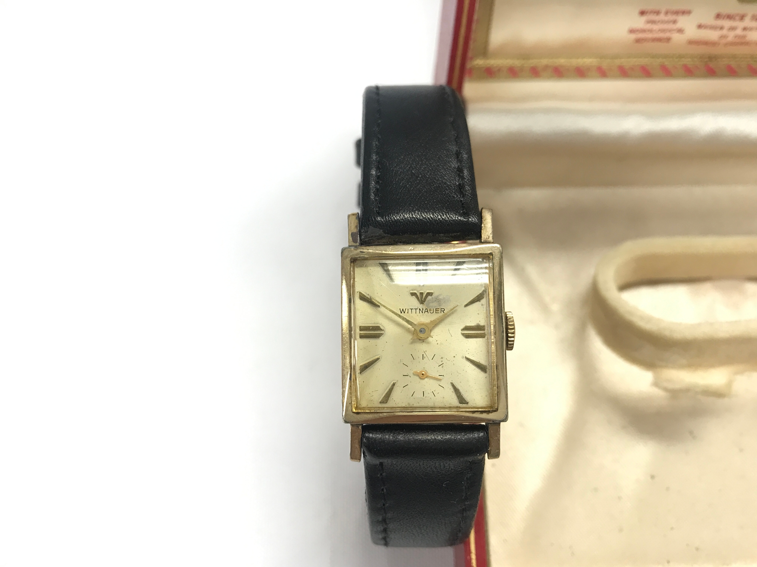 vintage Wittnauer mechanical wristwatch with a square gold-toned case and a sub-seconds dial, likely dating from the 1940s or 1950s Comes with box.