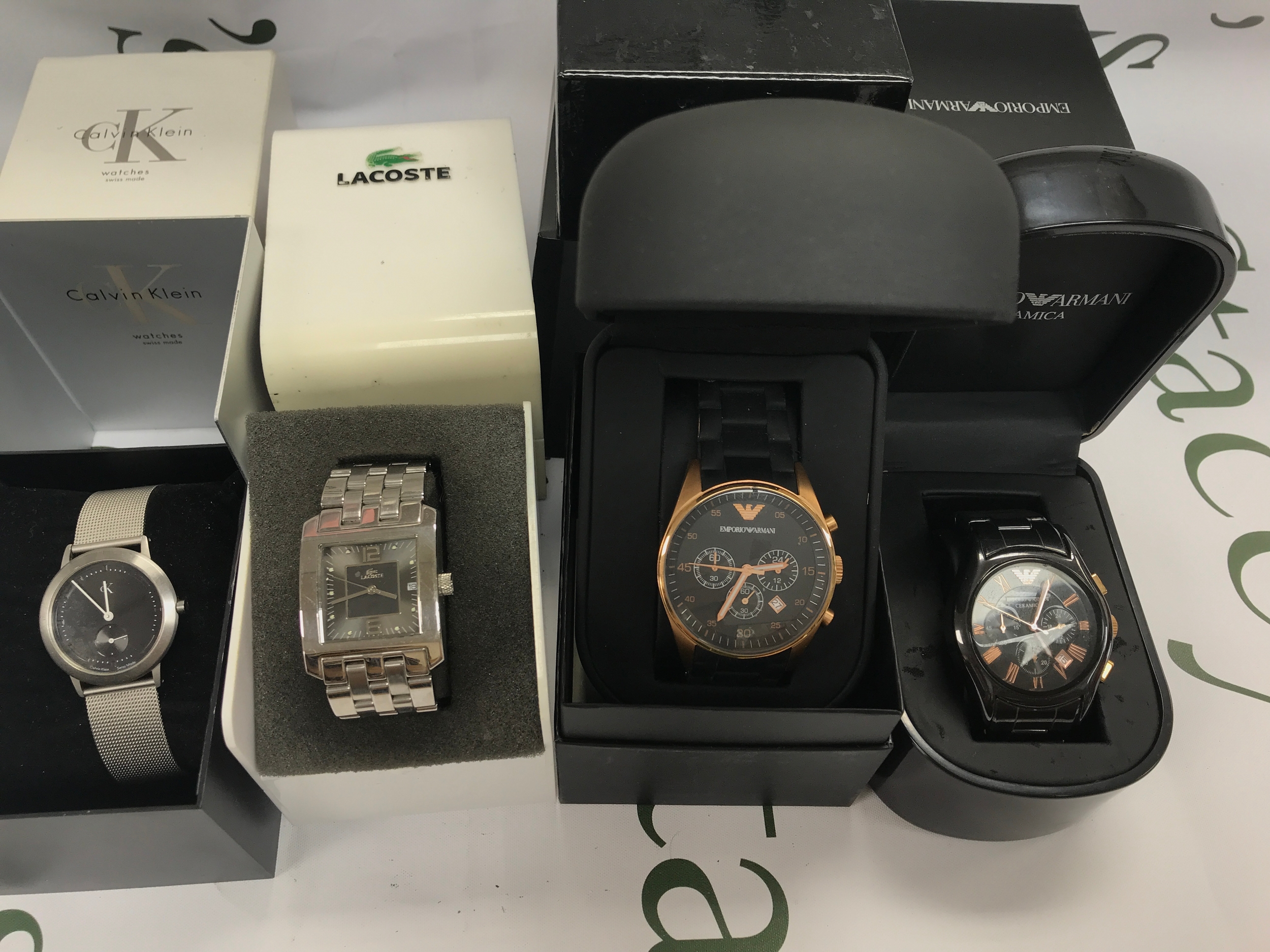 Four gents fashion watches including Armani and CK.