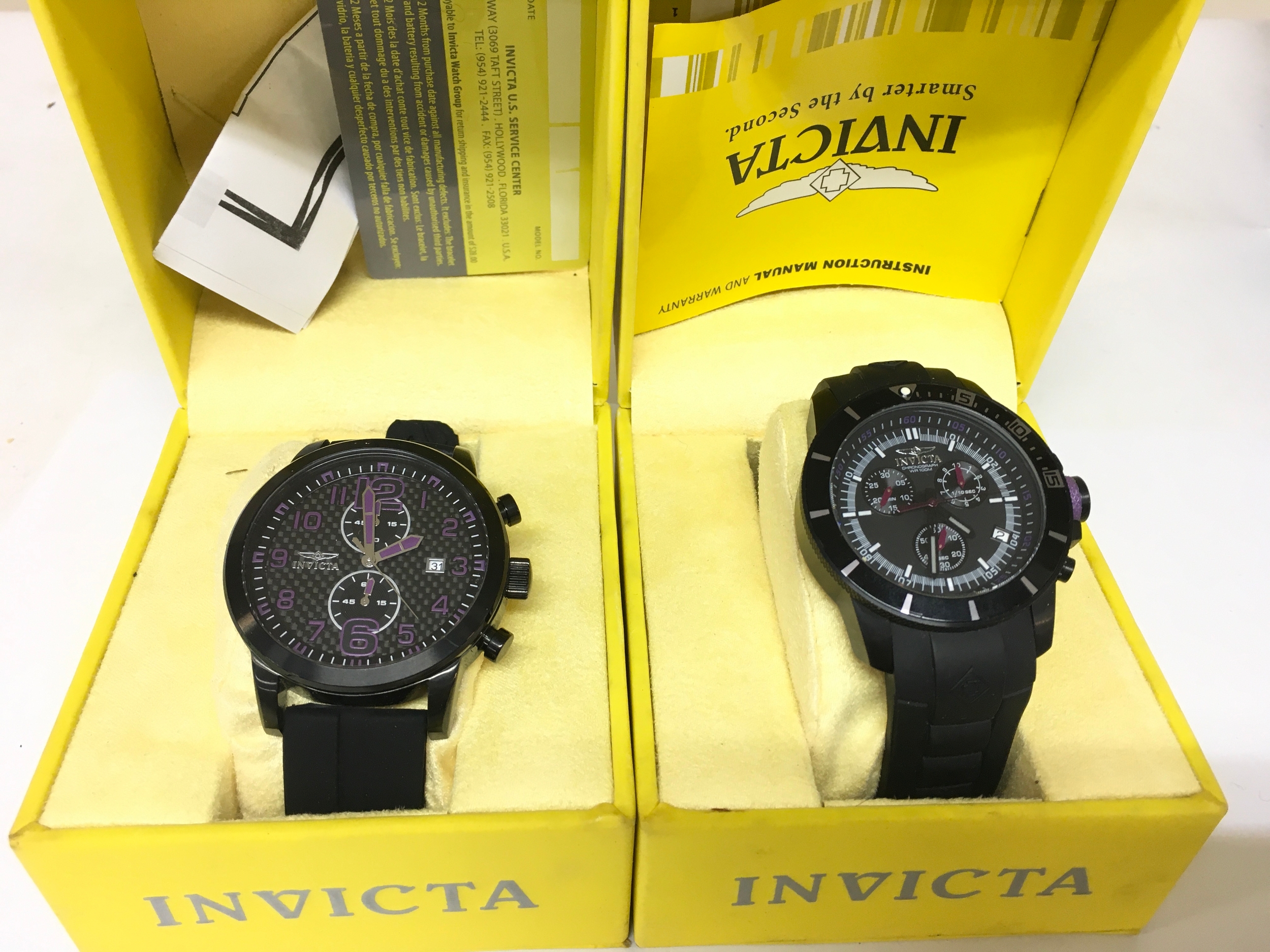 Two boxed gents Invicta wrist watches. Both seen running.