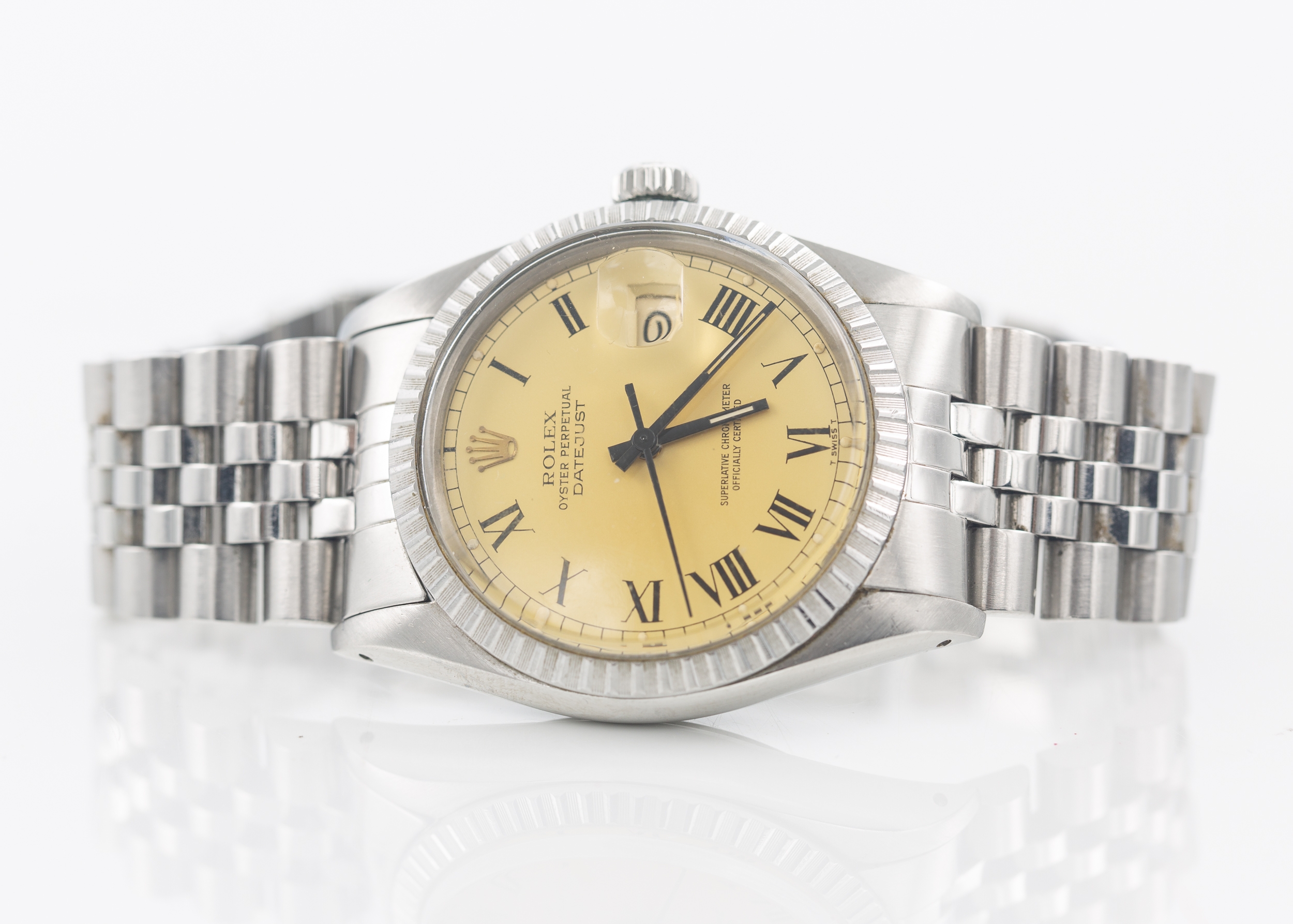 Rolex Datejust 36 reference 16030 featuring a champagne "Buckley" dial with painted black Roman numerals and a Jubilee bracelet. Comes with box. Winds and runs.