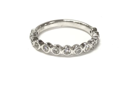 A 9ct white gold diamond half eternity ring. Size M and 2.15g