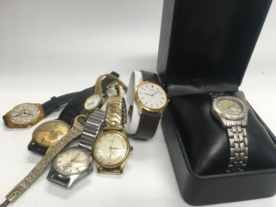A mixed assortment of gents and ladies watches.