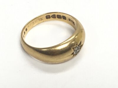 An 18ct gold ring set with an old cut diamond. Approx weight 7.57 grams, size P.