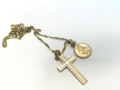 A 9ct gold chain with a cross pendant and st Christopher. Approx weight 4.97 grams.