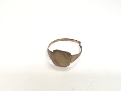A 9ct gold signet ring (cut). Approx weight 1.7 grams.
