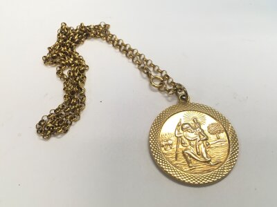 A 9ct gold belcher chain and st christopher pendant. Approx weight 11.9 grams.