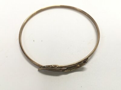 A 9ct gold snake bangle. Approx weight 5 grams.