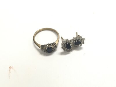 A 9ct gold sapphire ring and earrings set. Approx weight 2.40 grams.