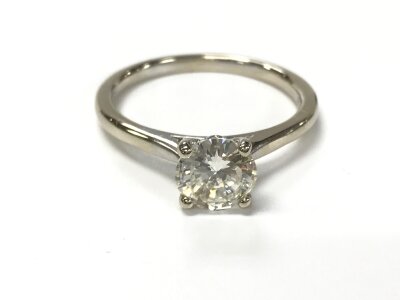 An 18ct white gold diamond solitaire ring. Size M and 2.64g