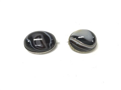 Two silver banded agate brooches.