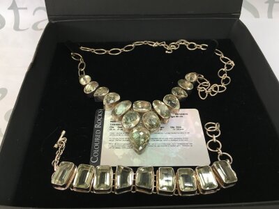 A sterling silver green amethyst necklace and bracelet