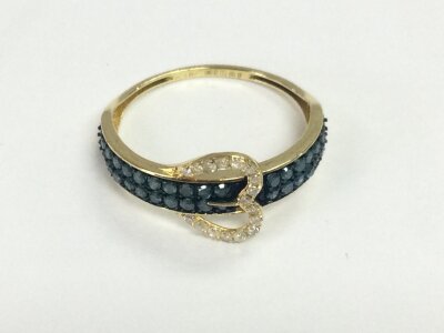 An 18ct gold blue diamond set ring. Size N with 0.40ct diamonds total and 1.18g with Cert.