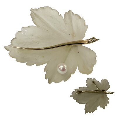A 1970s white gold and carved frosted glass leaf design brooch set with a single pearl. 5.5cm x 4.3cm