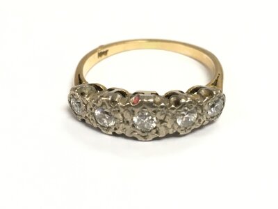 An 18ct gold five stone diamond ring
3.72g and size P
