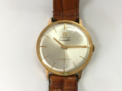 A gold plated Omega Seamaster watch. Approximately 36mm case.